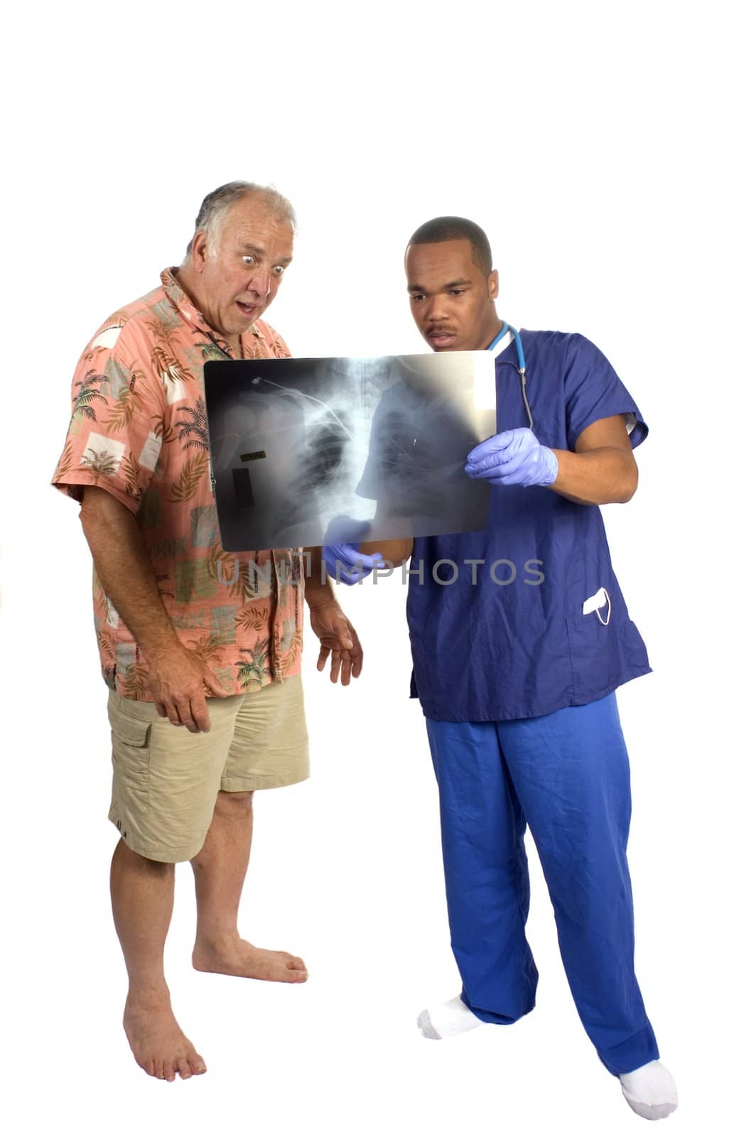 Doctor explaining x-ray to surprised patient