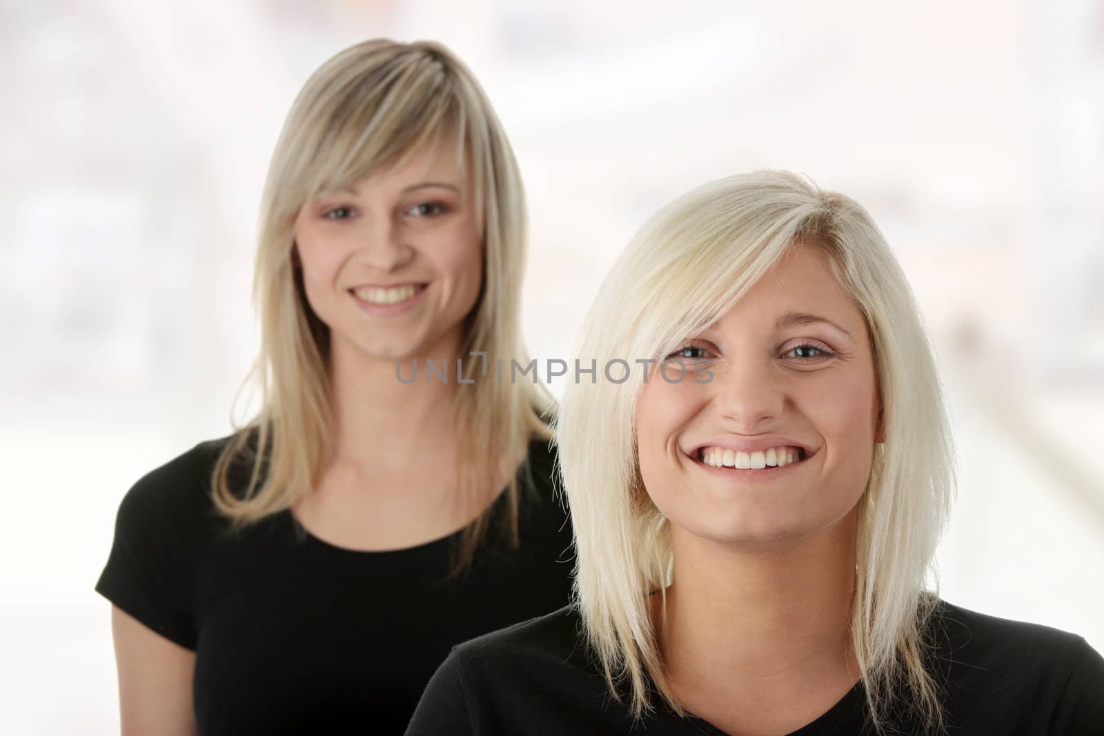 Portrait of two casual caucasian women (students or business people)