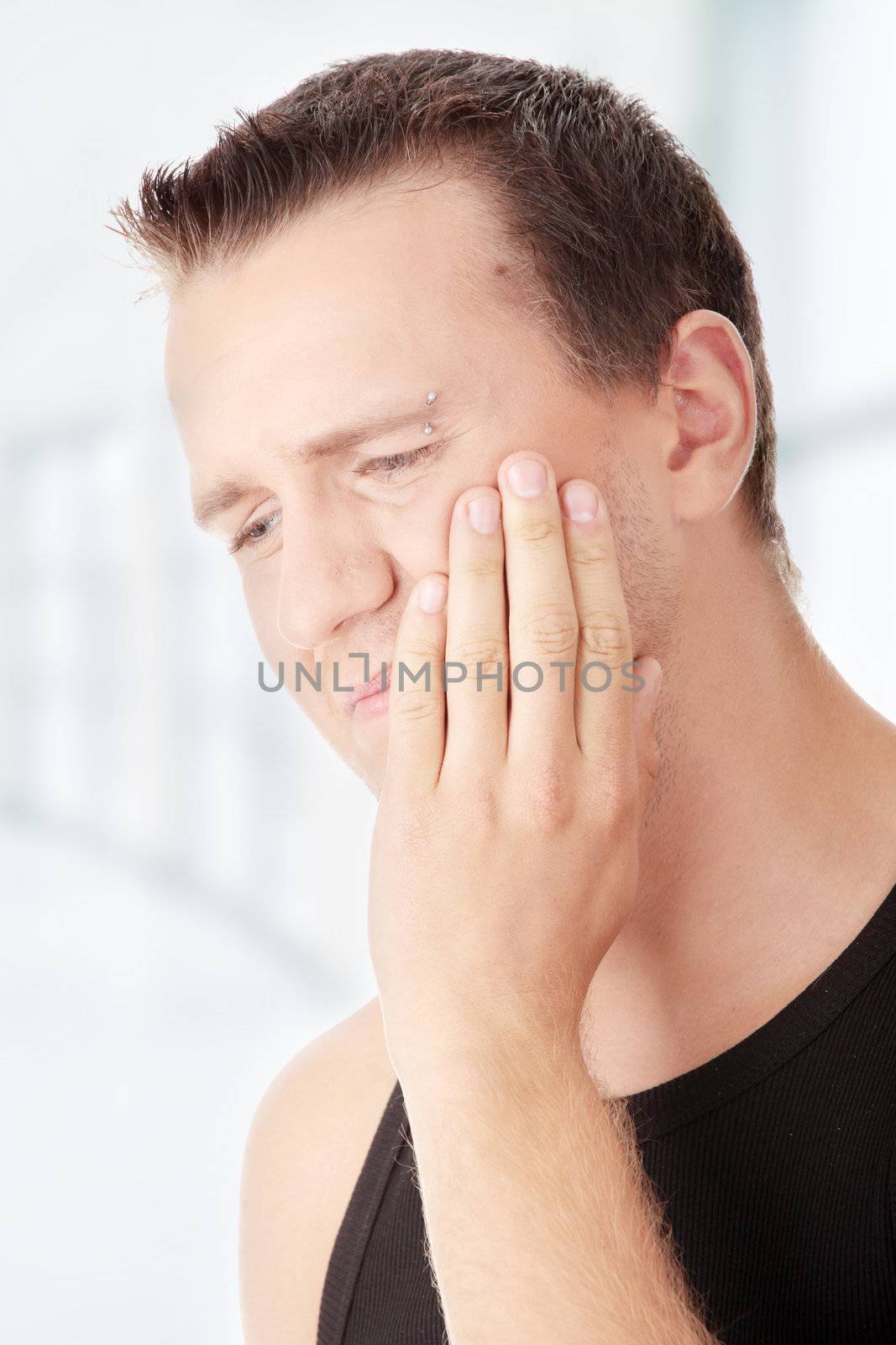 Man with pain expression isolated on white