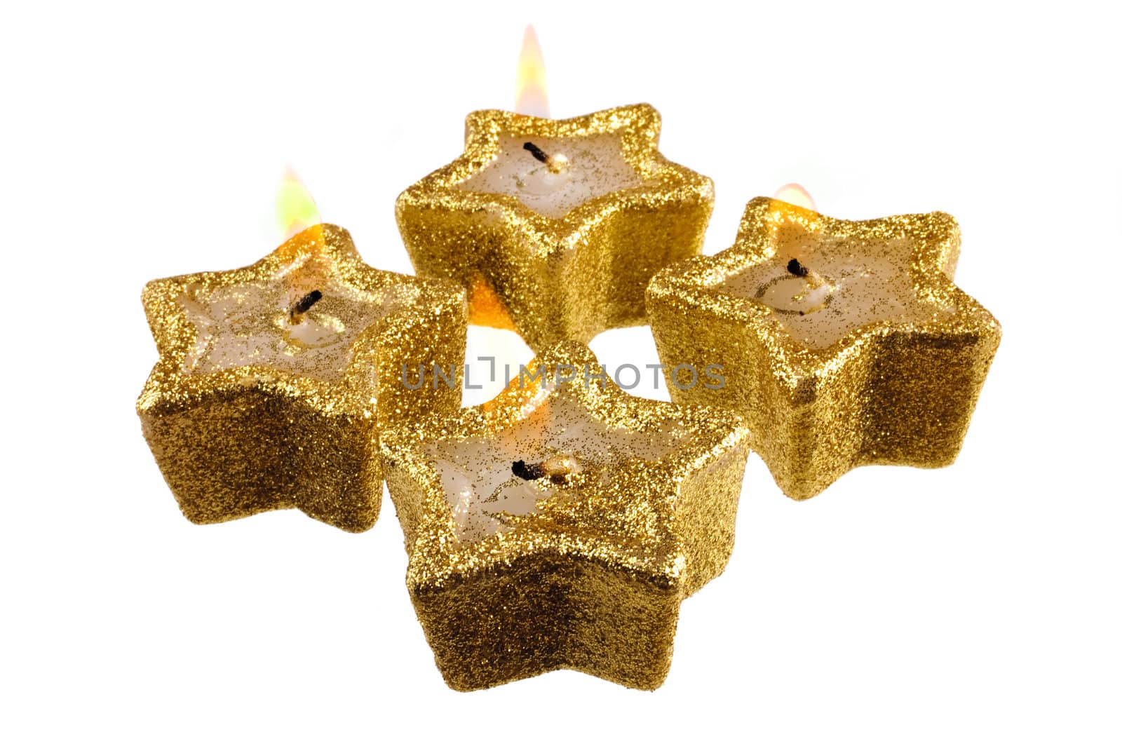festive five pointed star candles burning on a white background