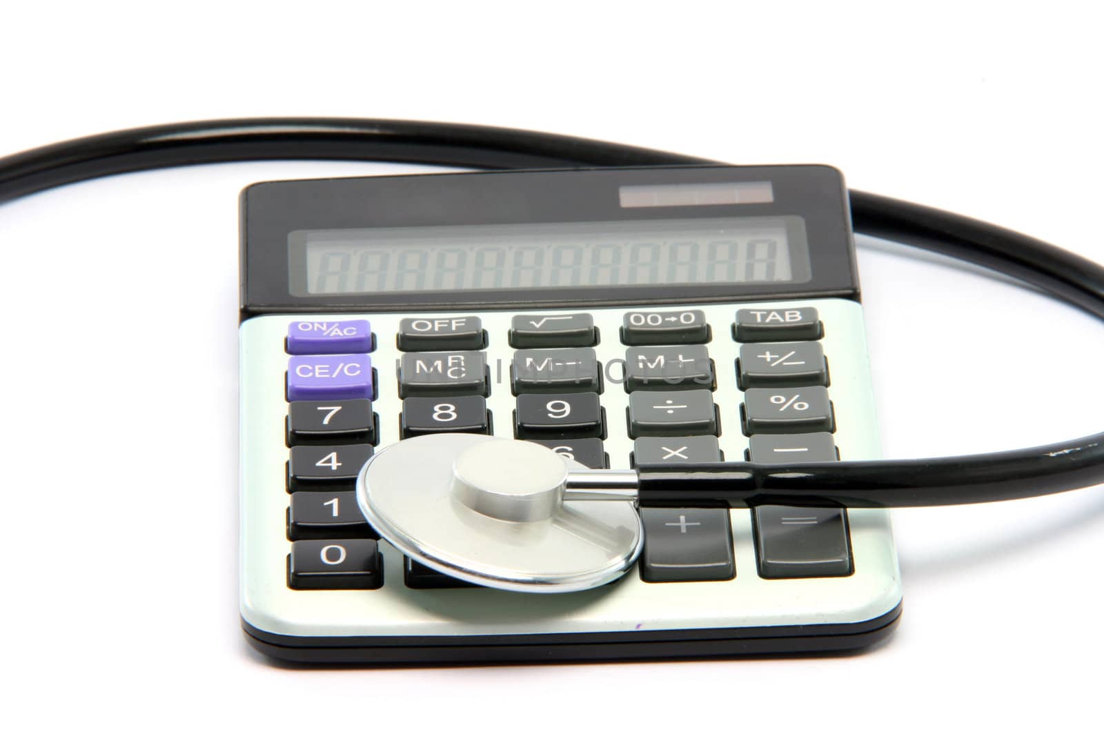 stethoscope on calculator isolated on white background healthcare and finance concepts