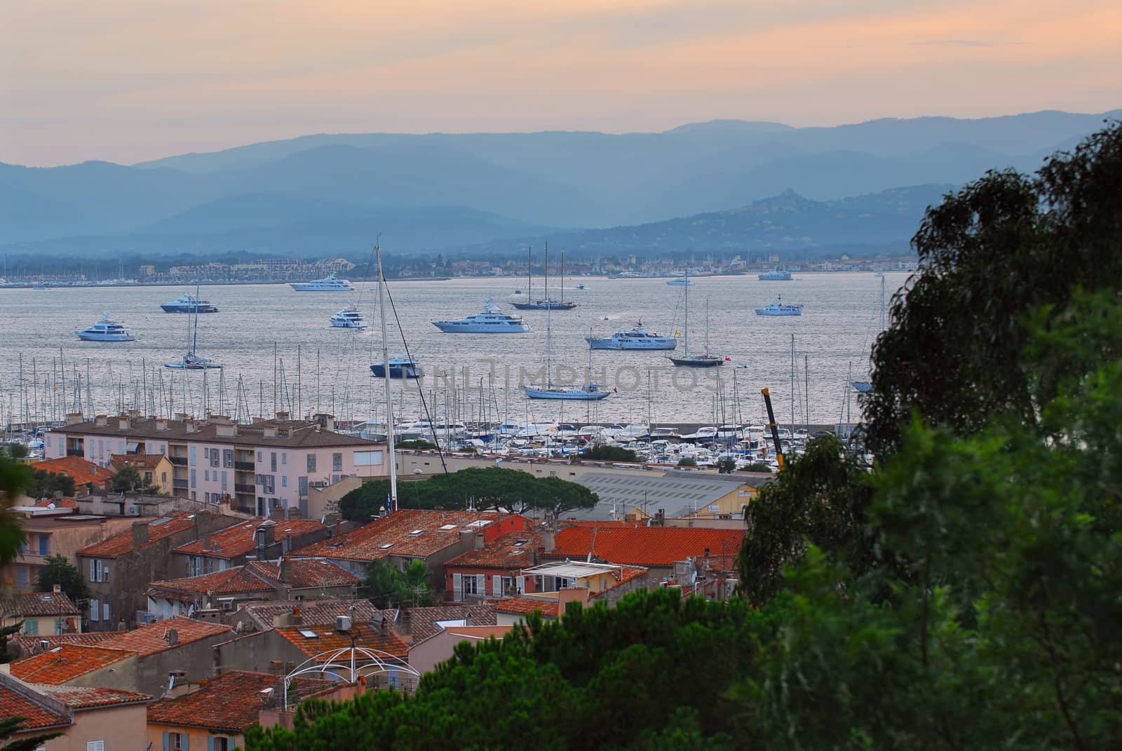 View on St. Tropez harbor in French Riviera at sunset