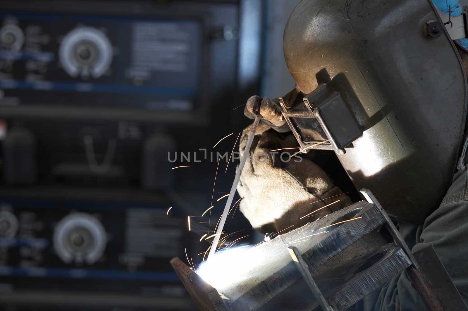 a welder working at shipyard during day shift