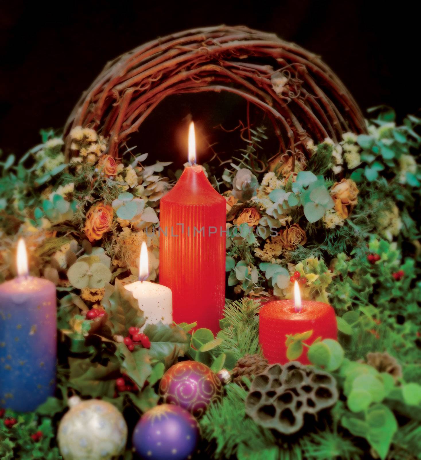 Christmas candles as a background for Christmas or religious theme. Focus is in the centre and edges are blurred.
