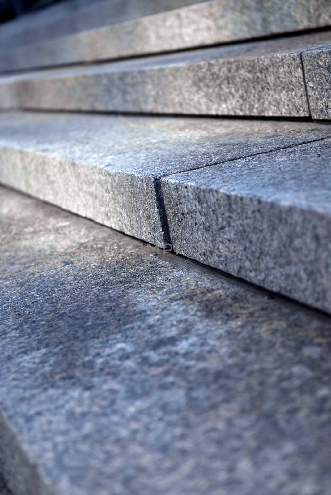 Stairway with granite stone steps in perspective close up