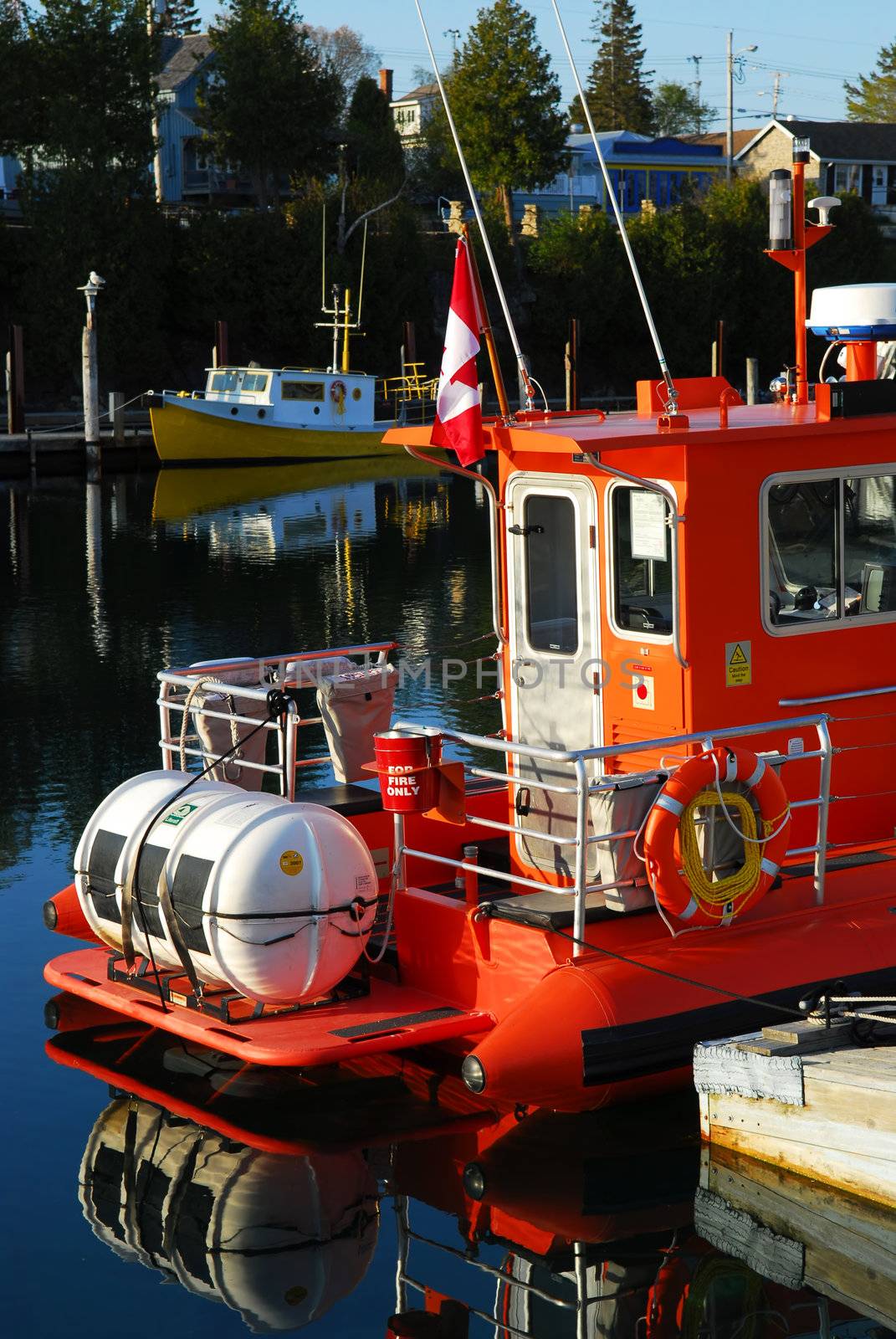 Fishing boats at the wooden dock in early morning in Tobermory Ontario Canada