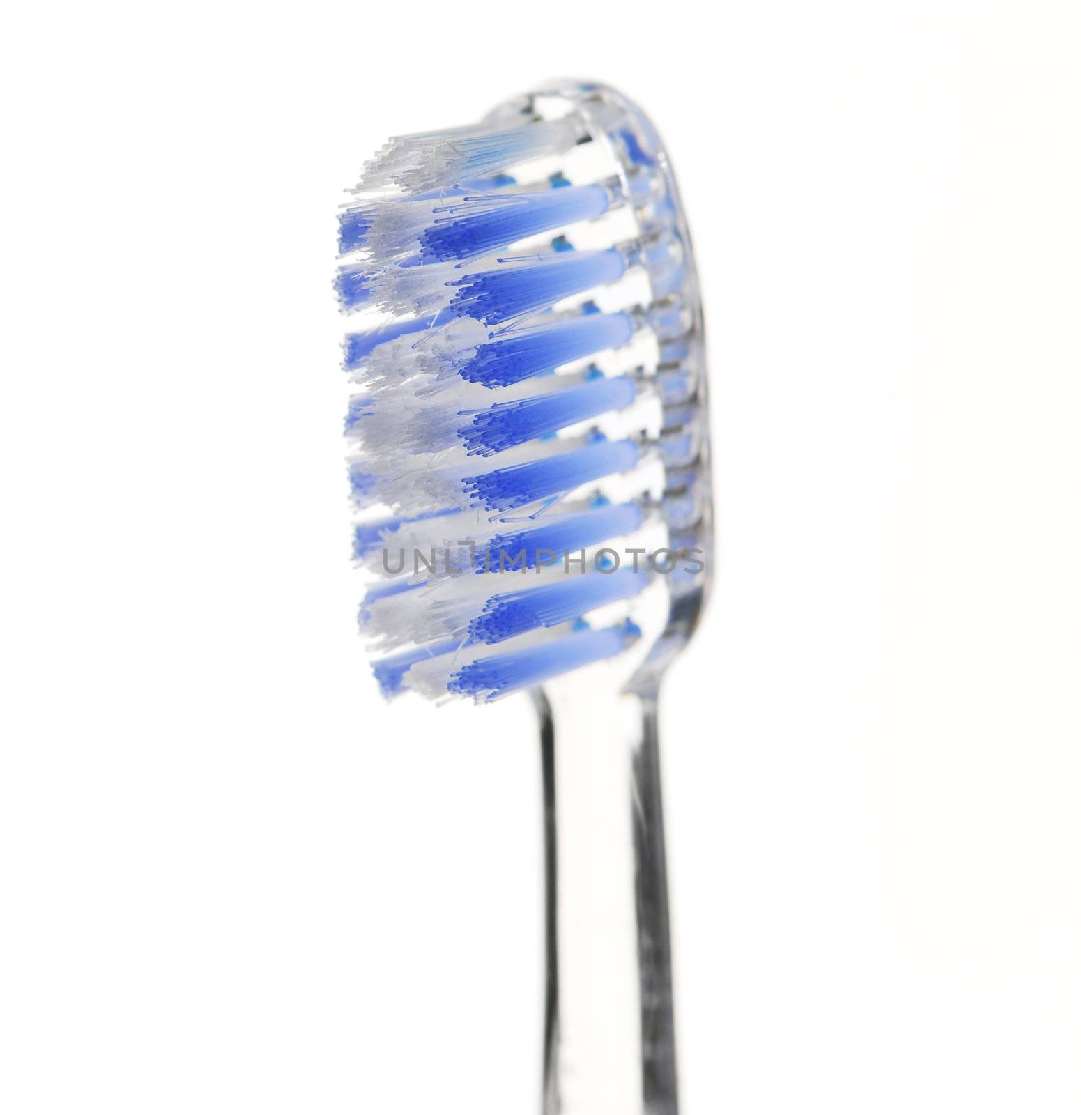 Clear toothbrush isolated on white background, closeup