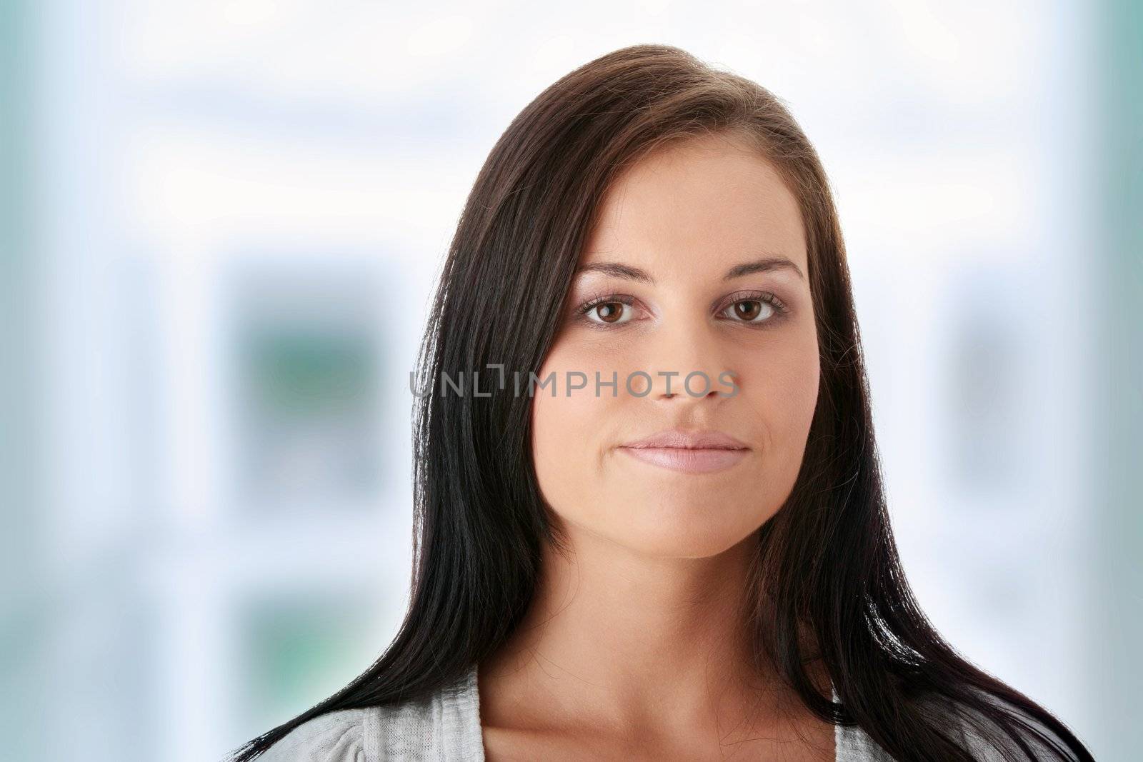Young woman (student or businesswoman) portrait. Isolated on white background