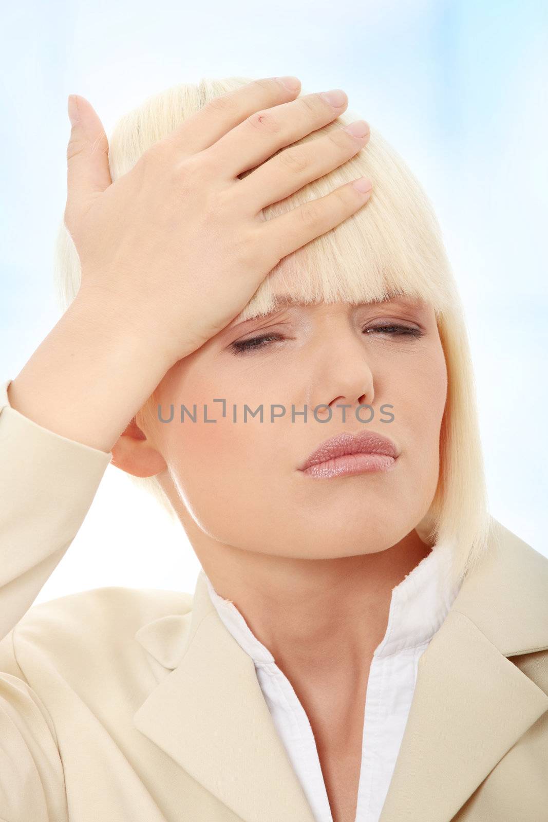 Young businesswoman with headache,Over abstract blue background