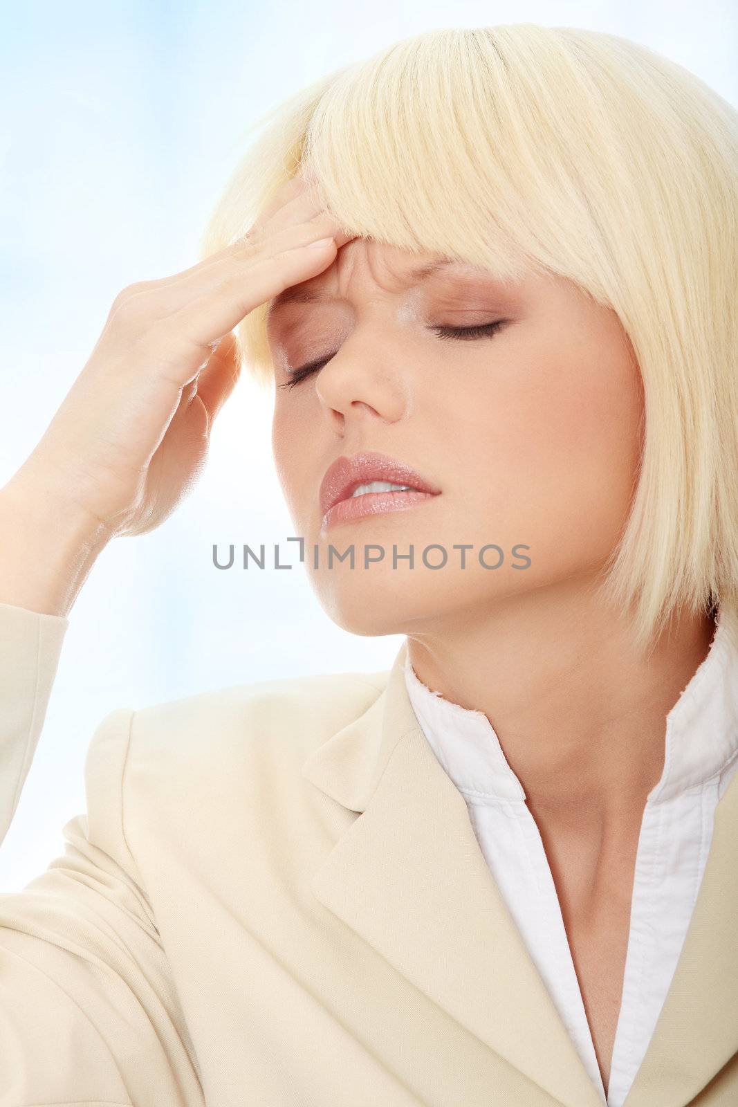 Young businesswoman with headache,Over abstract blue background