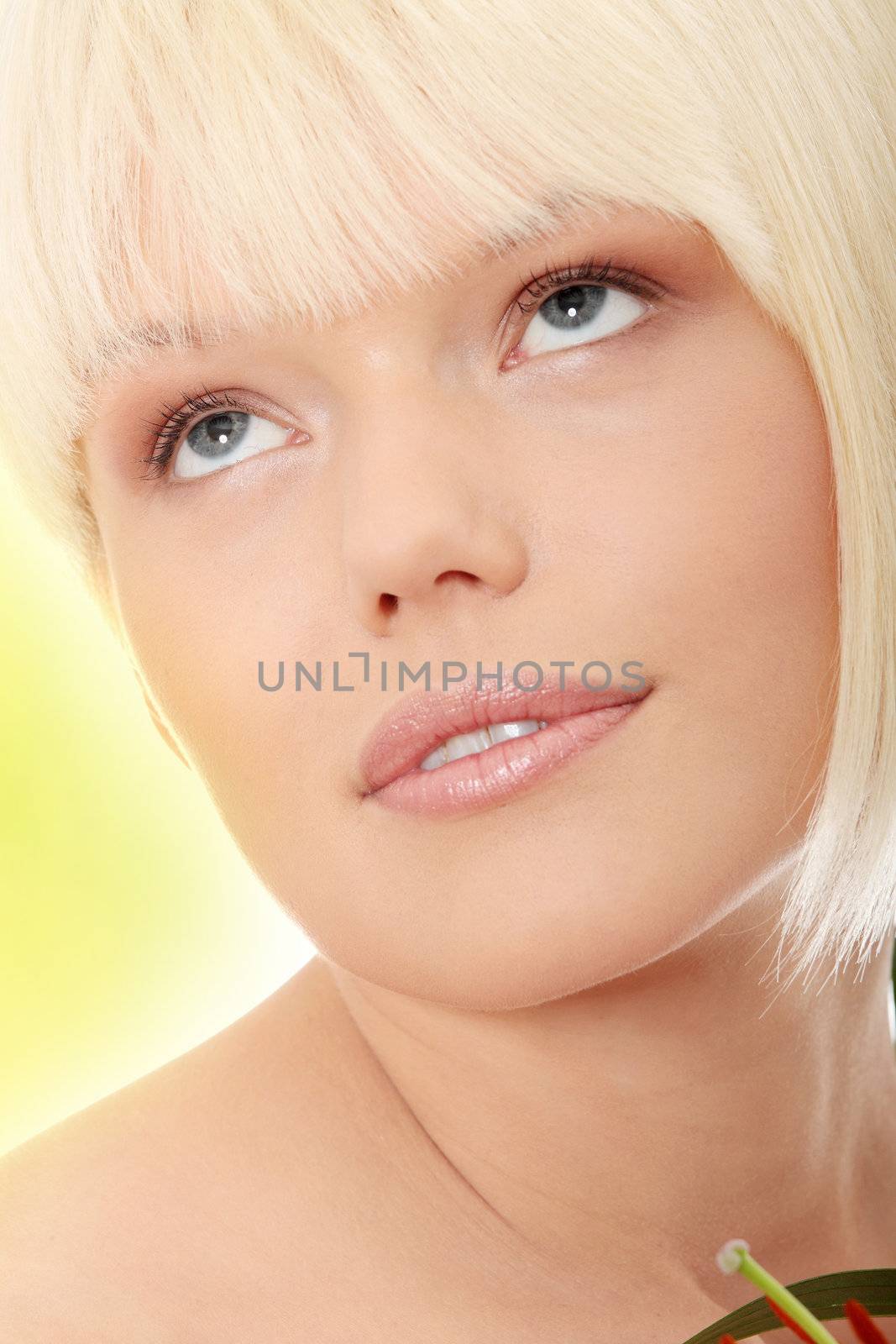 Portrait of the attractive girl without a make-up Over abstract green background