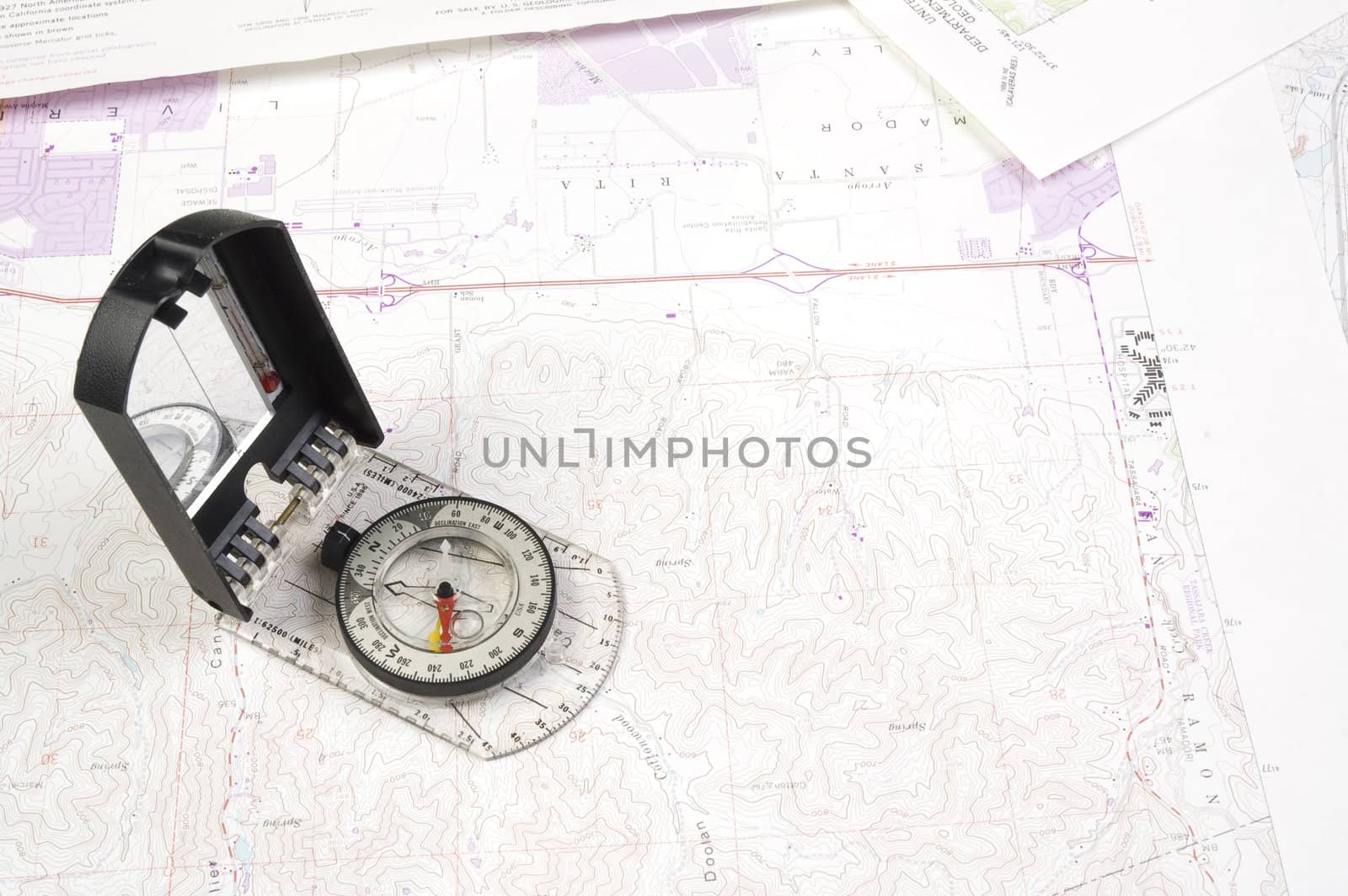 Topographical maps of an area under development with a acompass 