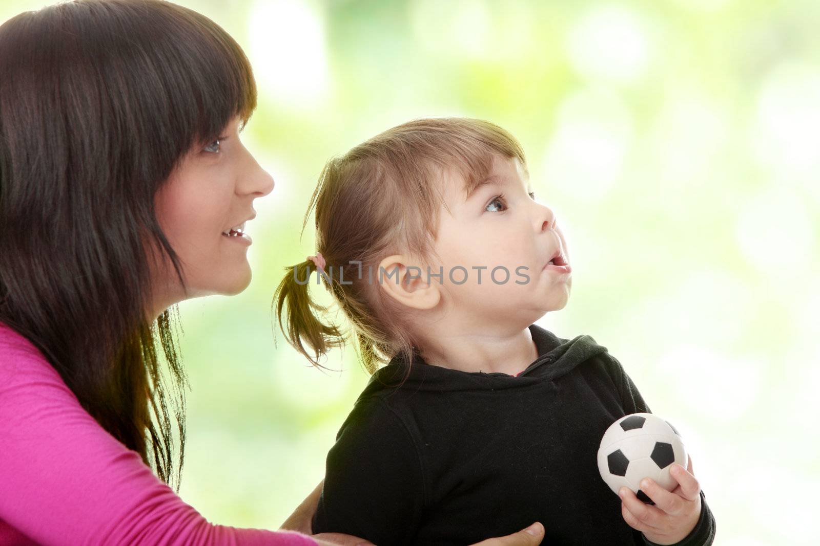 Portrait of a 2 year old girl with young mum