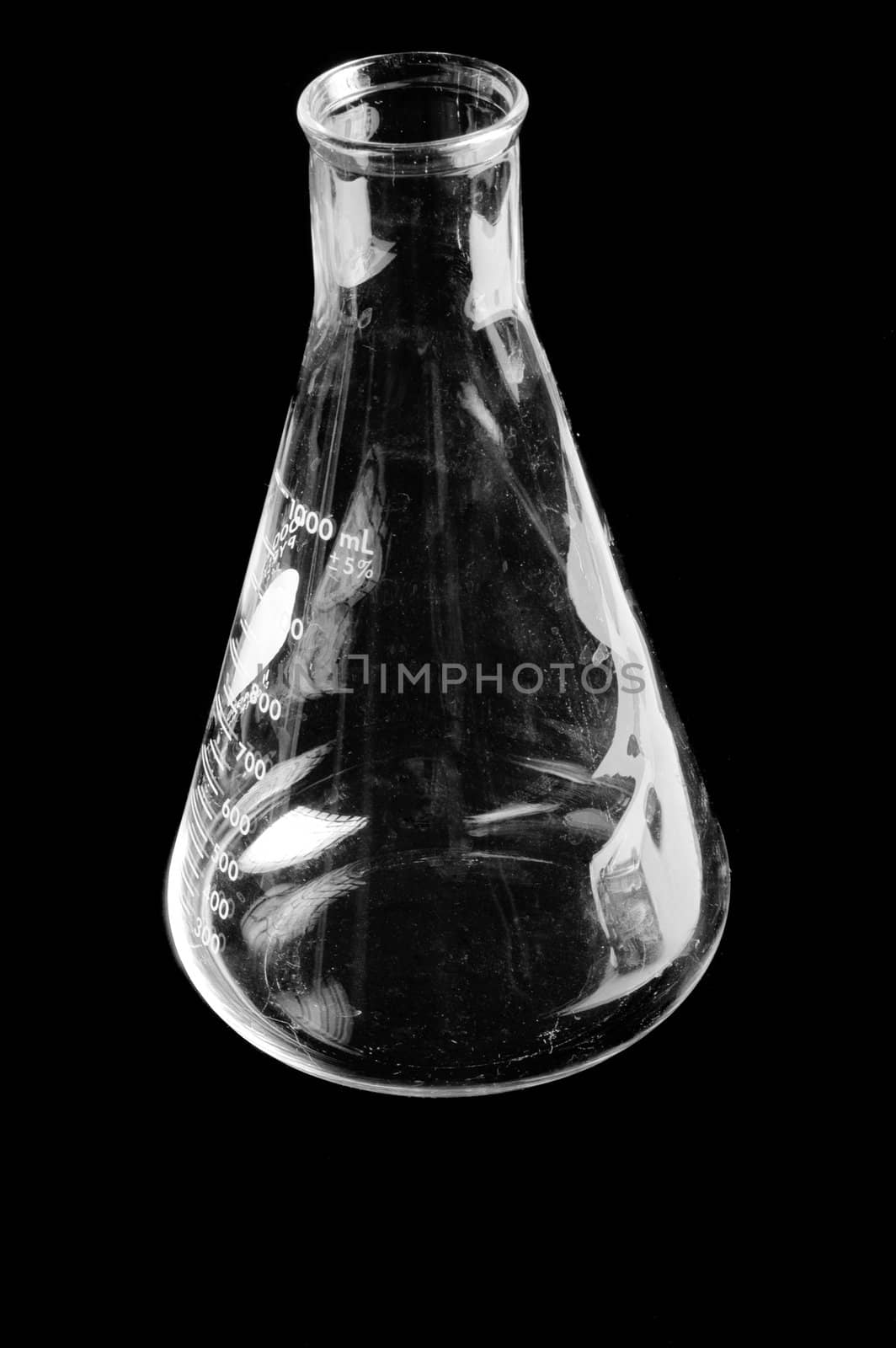 scientific beaker isolated on a black background