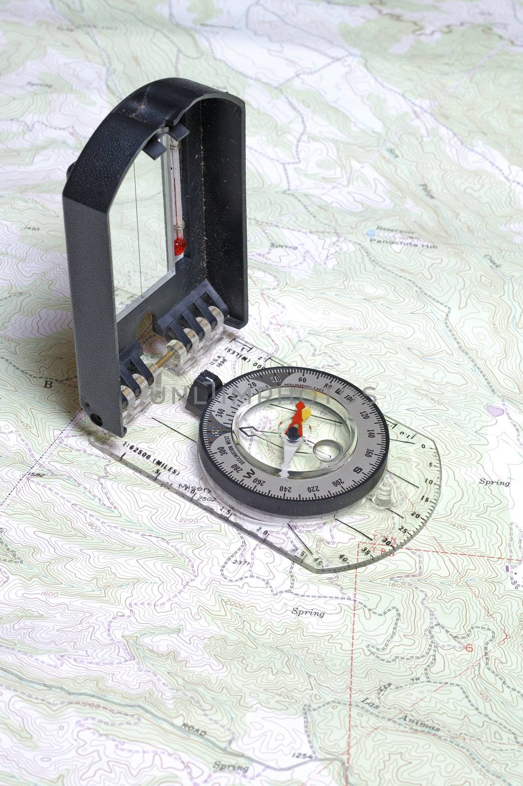 Closeup of compass and a topographical map showing detail