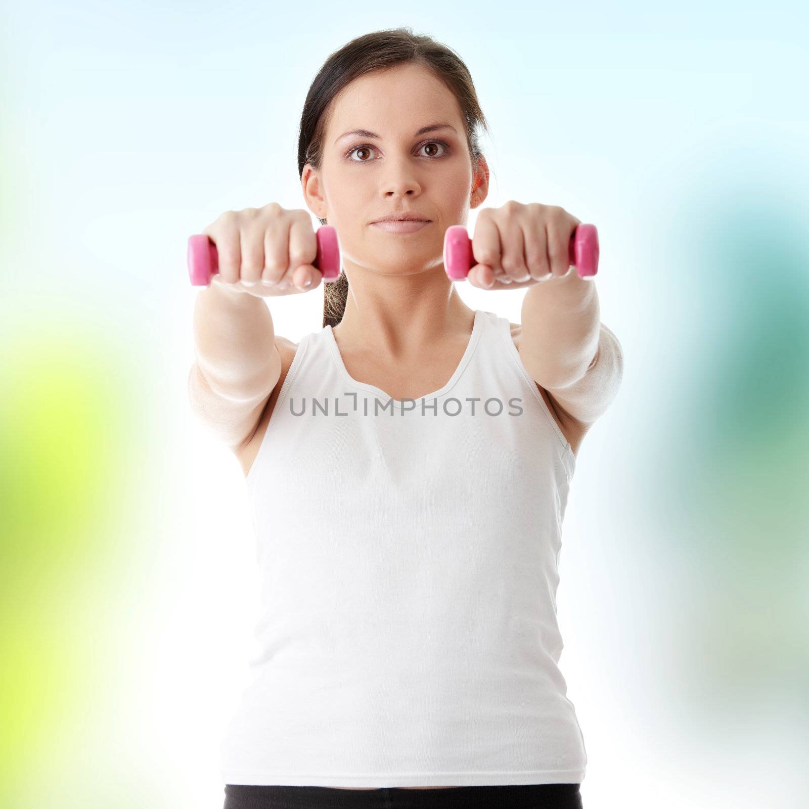 Young beautiful woman during fitness time and exercising