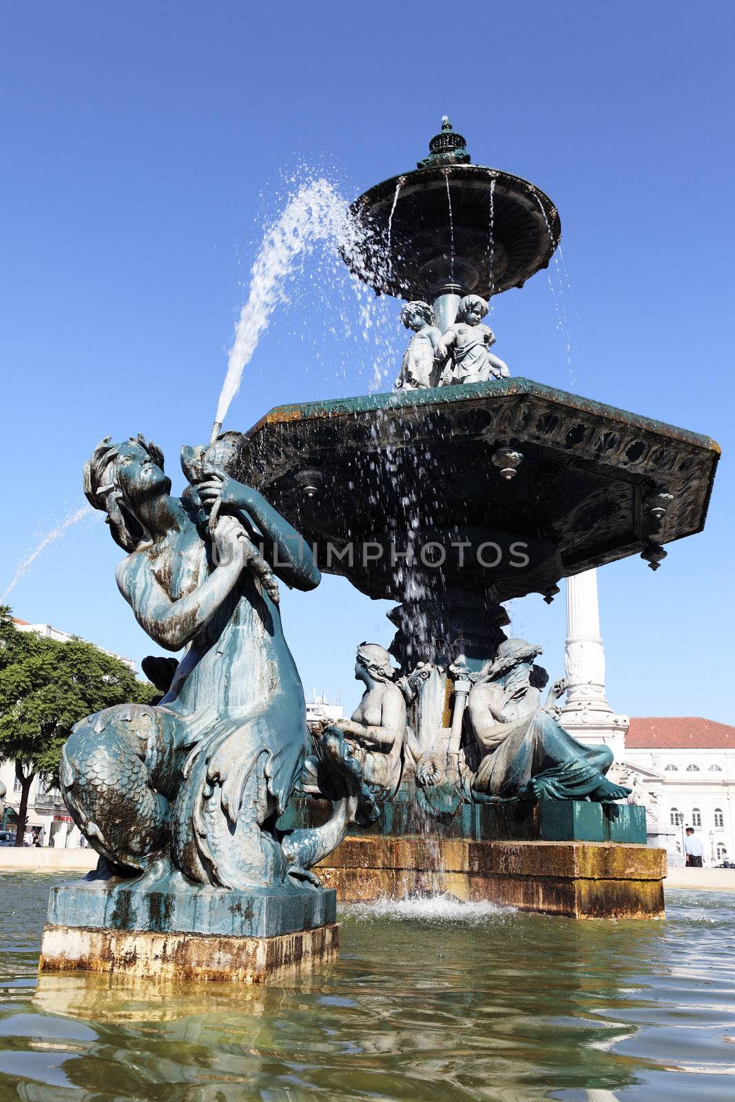 Baroque fountain on rossio square the liveliest placa in Lisbon 