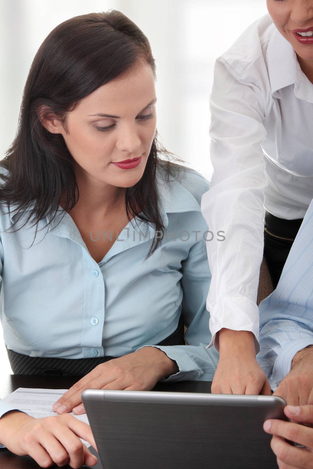 Interracial business team working at laptop in a office