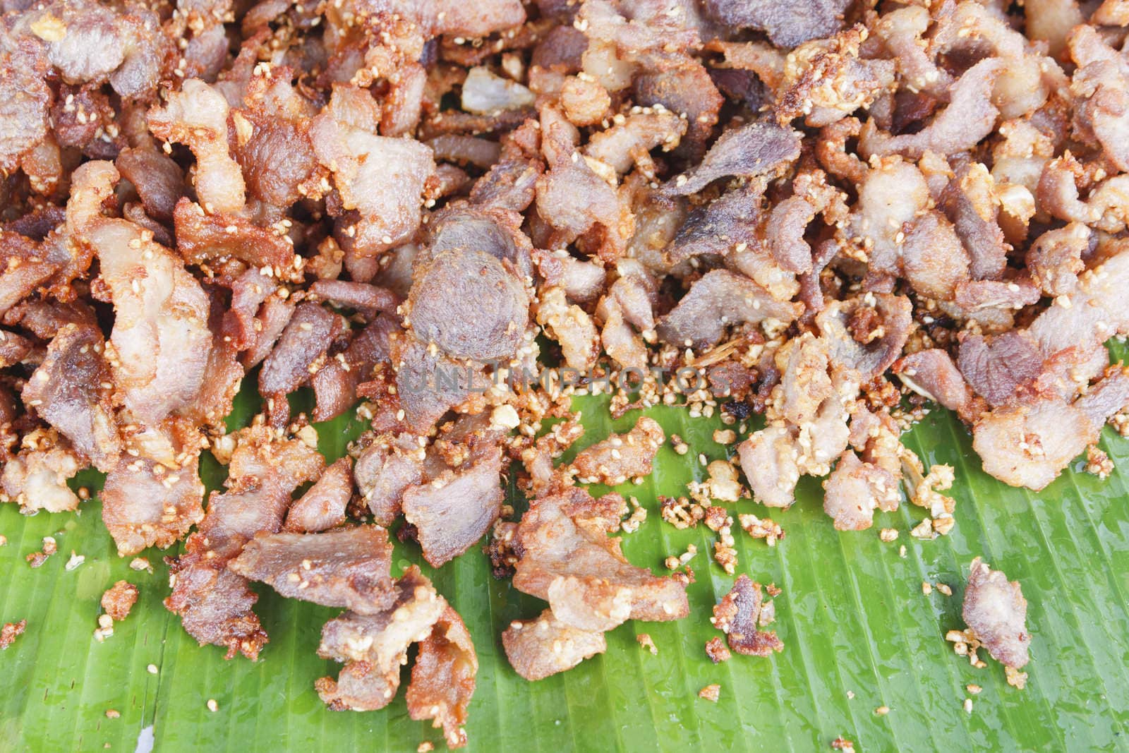 Deep fried pork with sesame on banana leaf, thai style