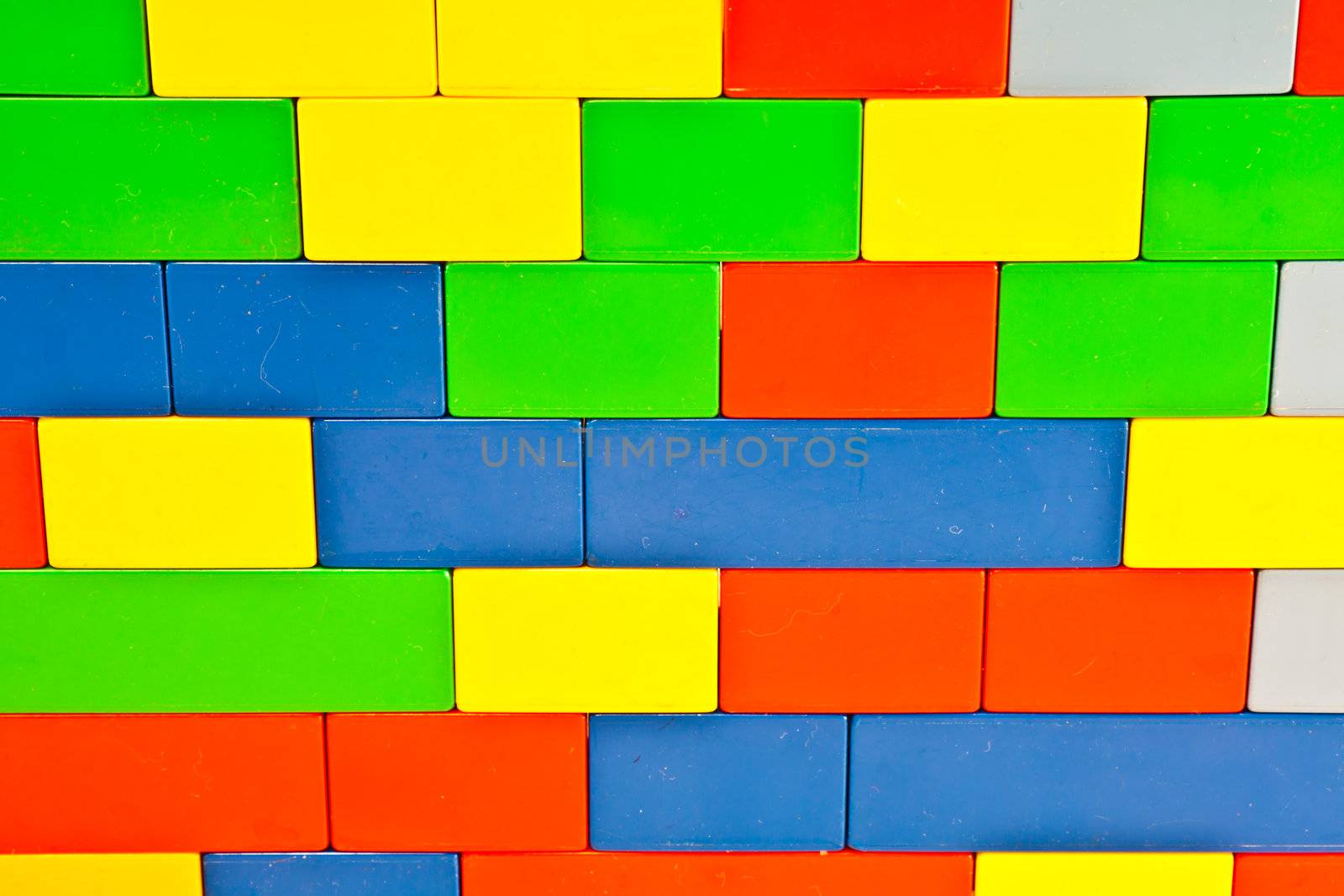 Background of plastic building blocks.  Bright colors.