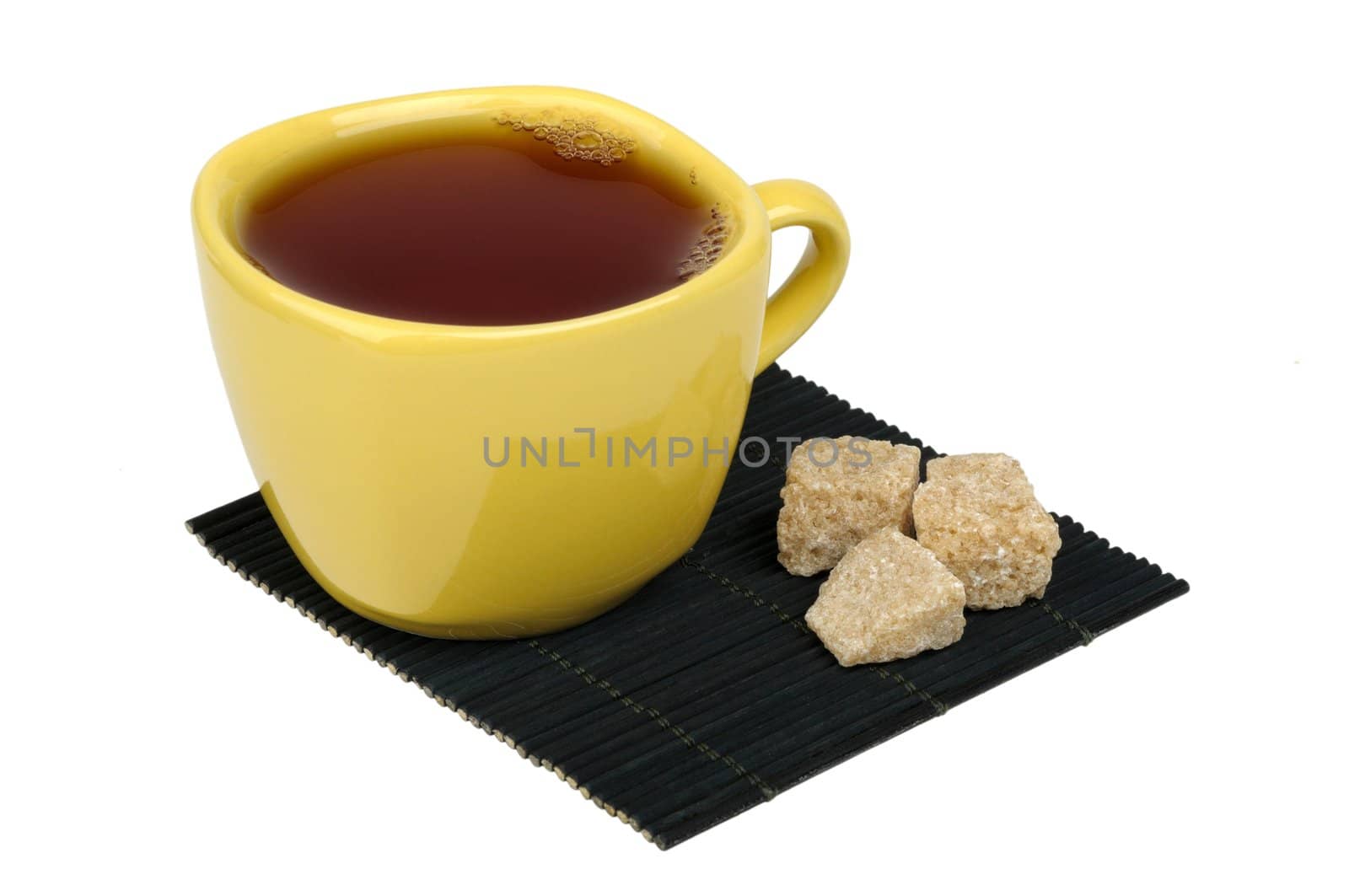 tea and sugar cane on the mat is isolated on a white background