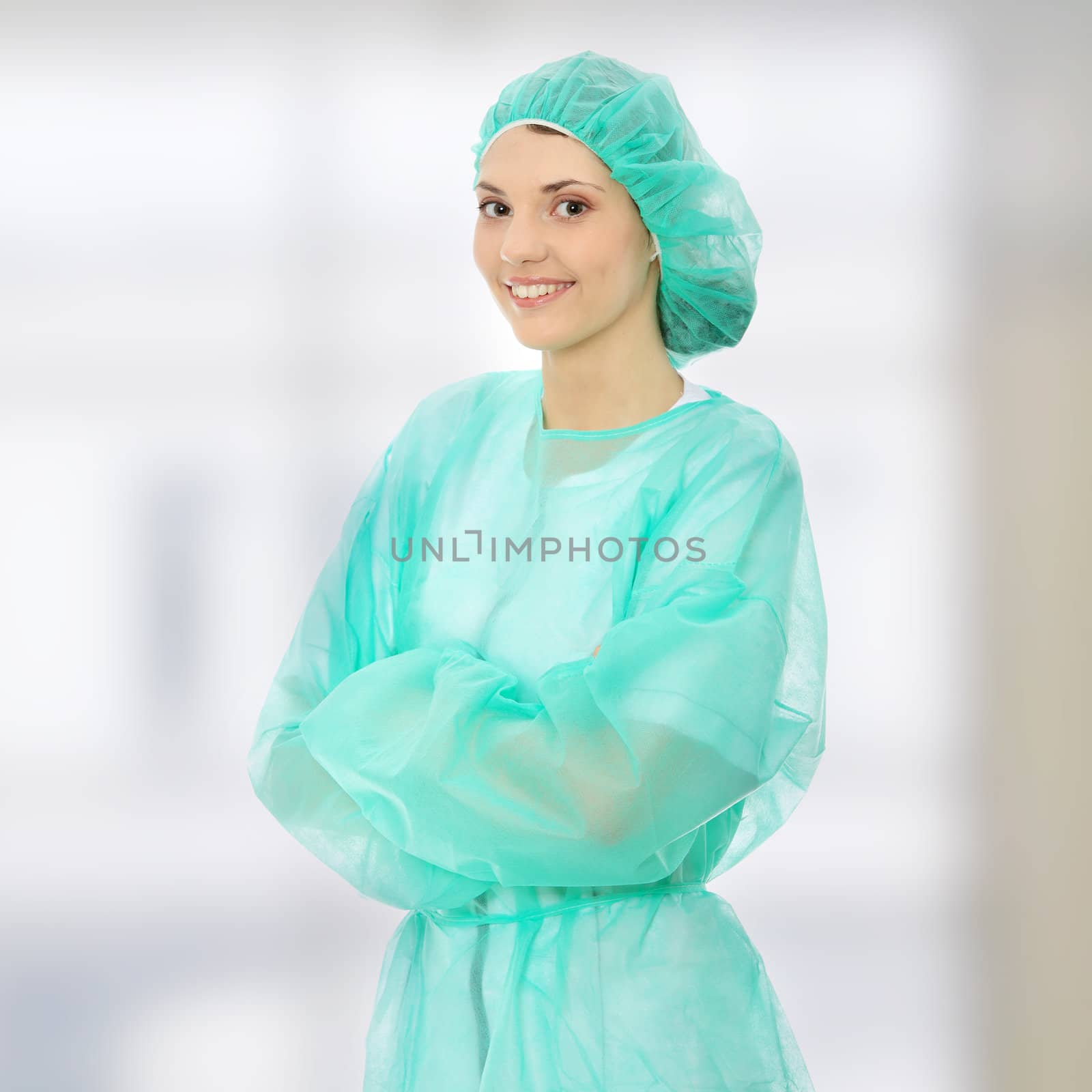 Portrait of female surgeon or nurse wearing protective uniform