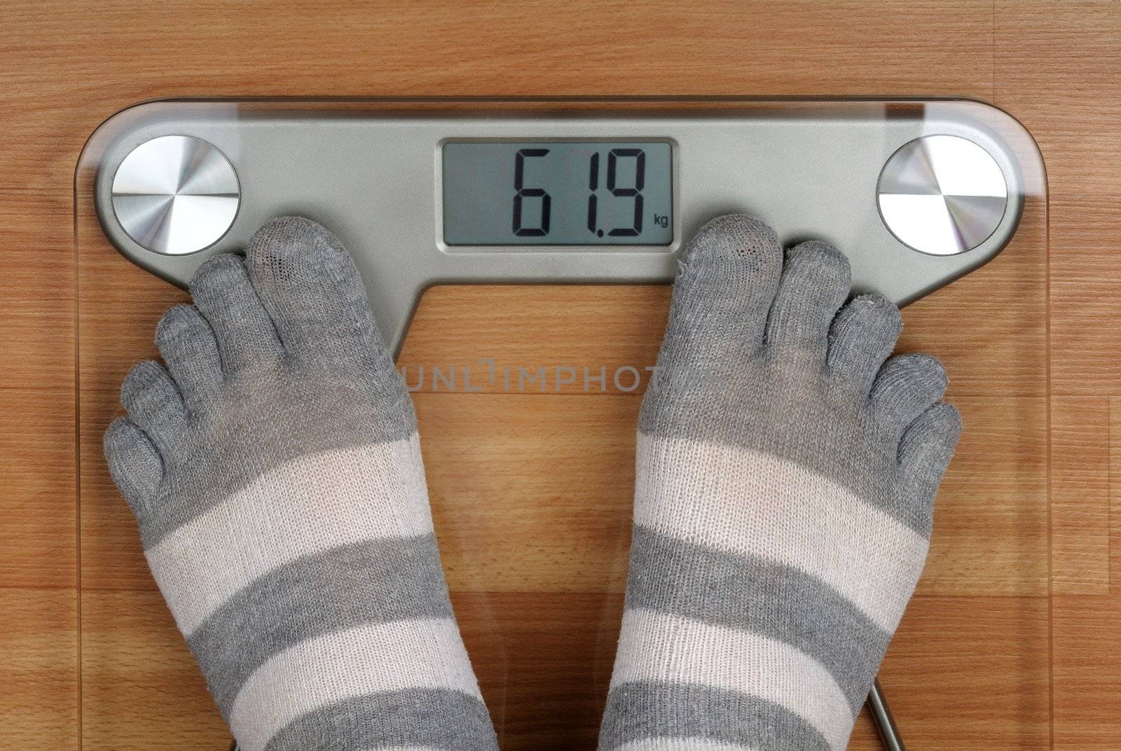 weighed on the scales in your socks