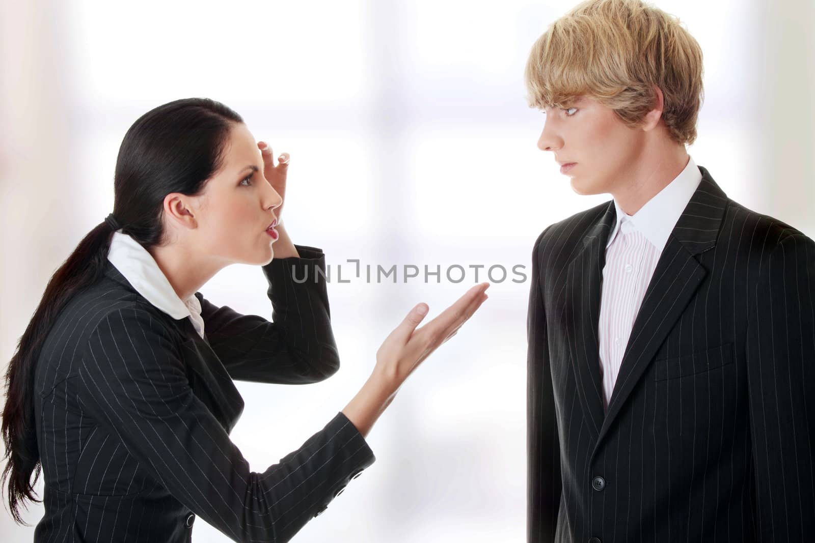Work Colleagues arguing (woman shouting on man)