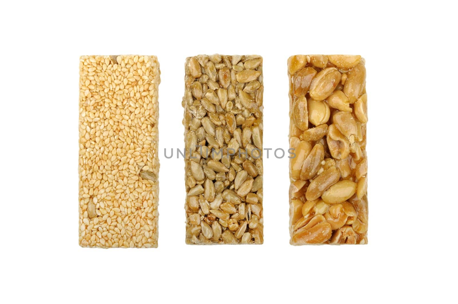 gozinaki of sunflower seeds sesame seeds and peanuts isolated on a white background