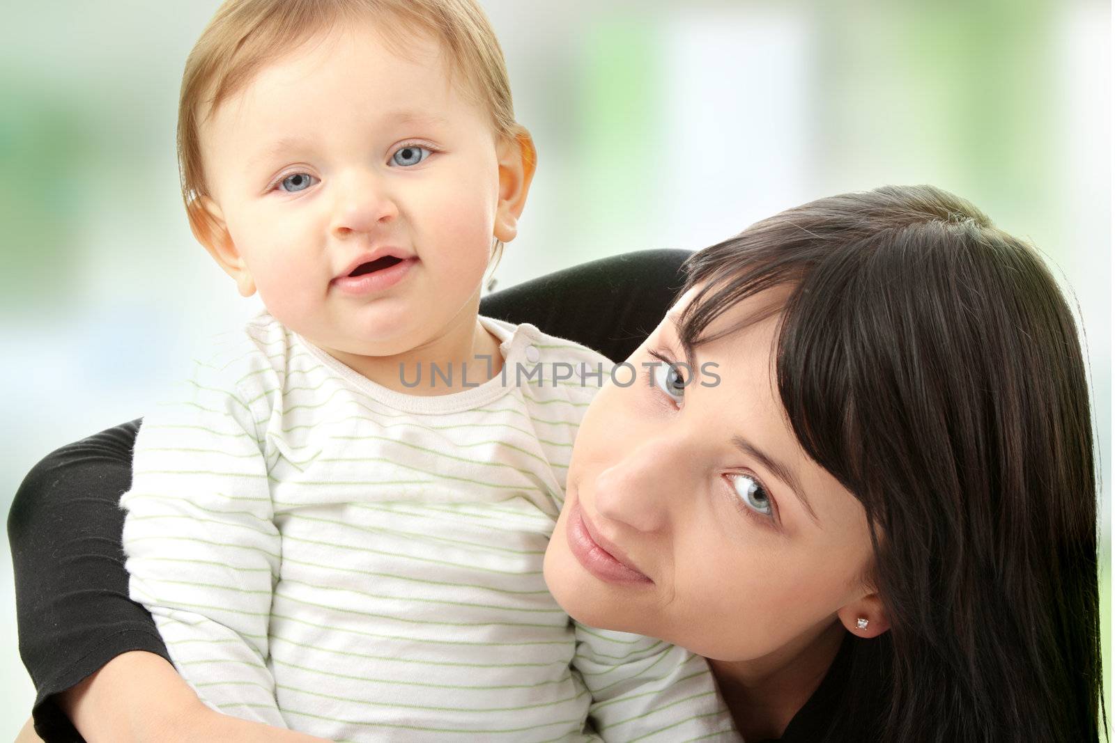 Young mother with baby girl isolated on white background