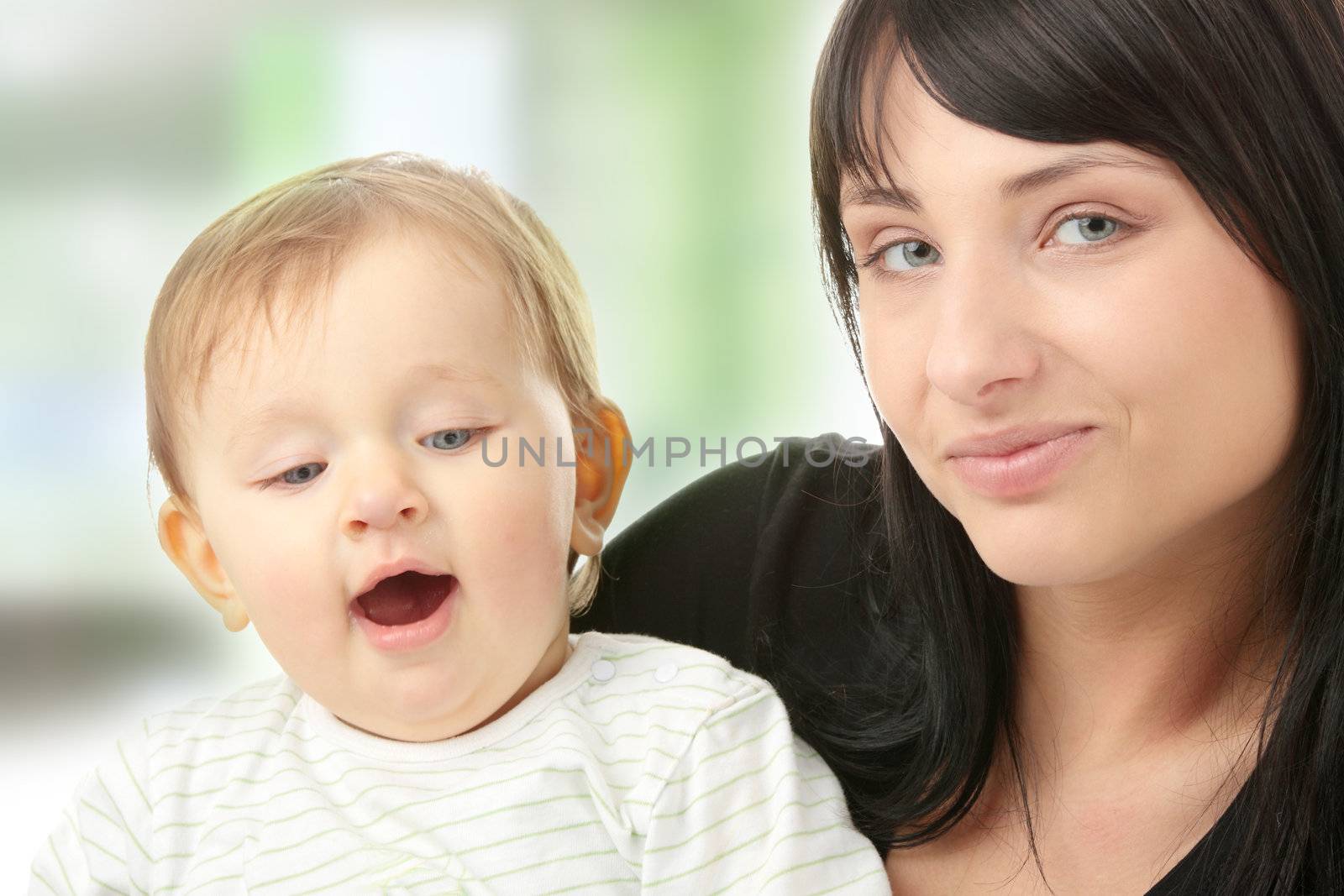 Young mother with baby girl isolated on white background