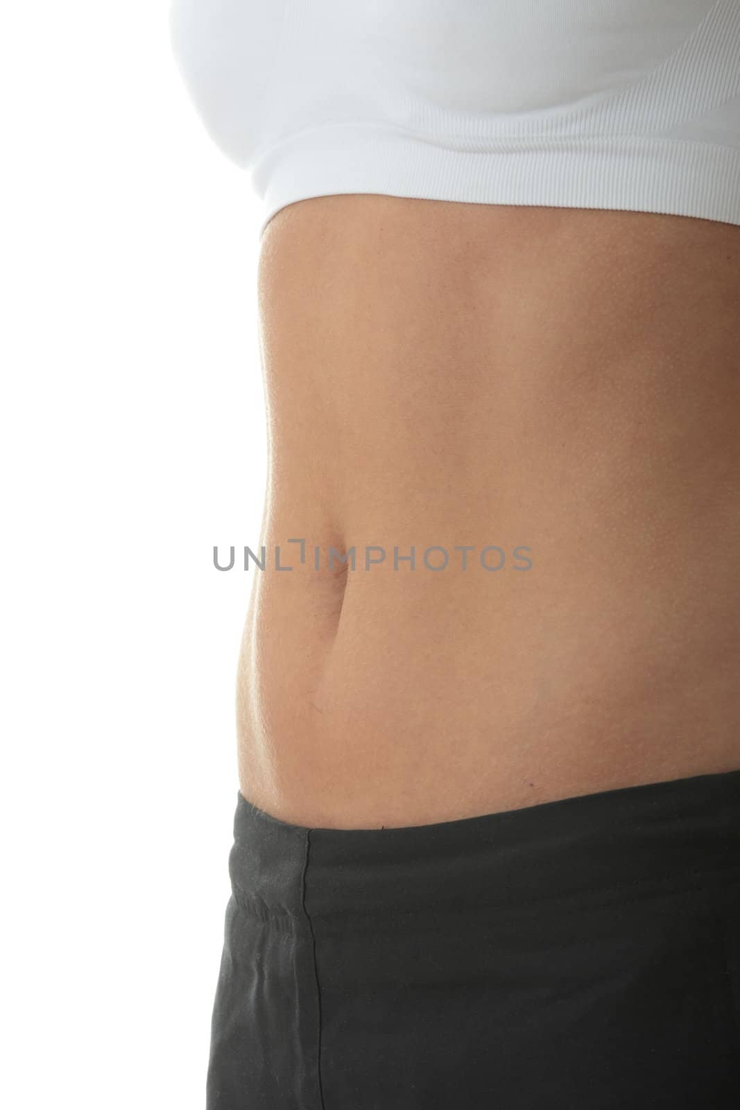 Midsection of a physically fit young woman over white background