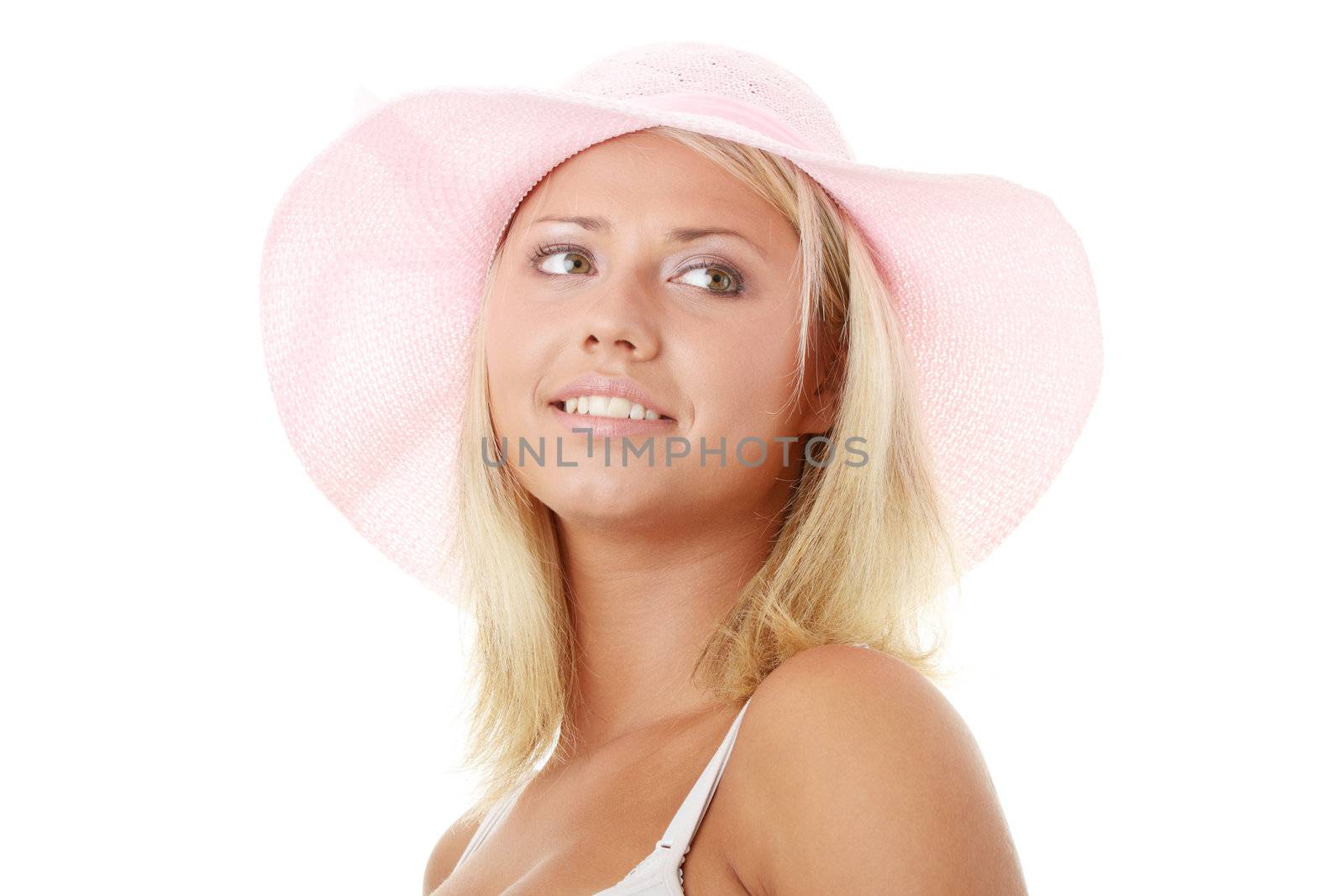 Portrait of an attractive young woman wearing a pink straw hat