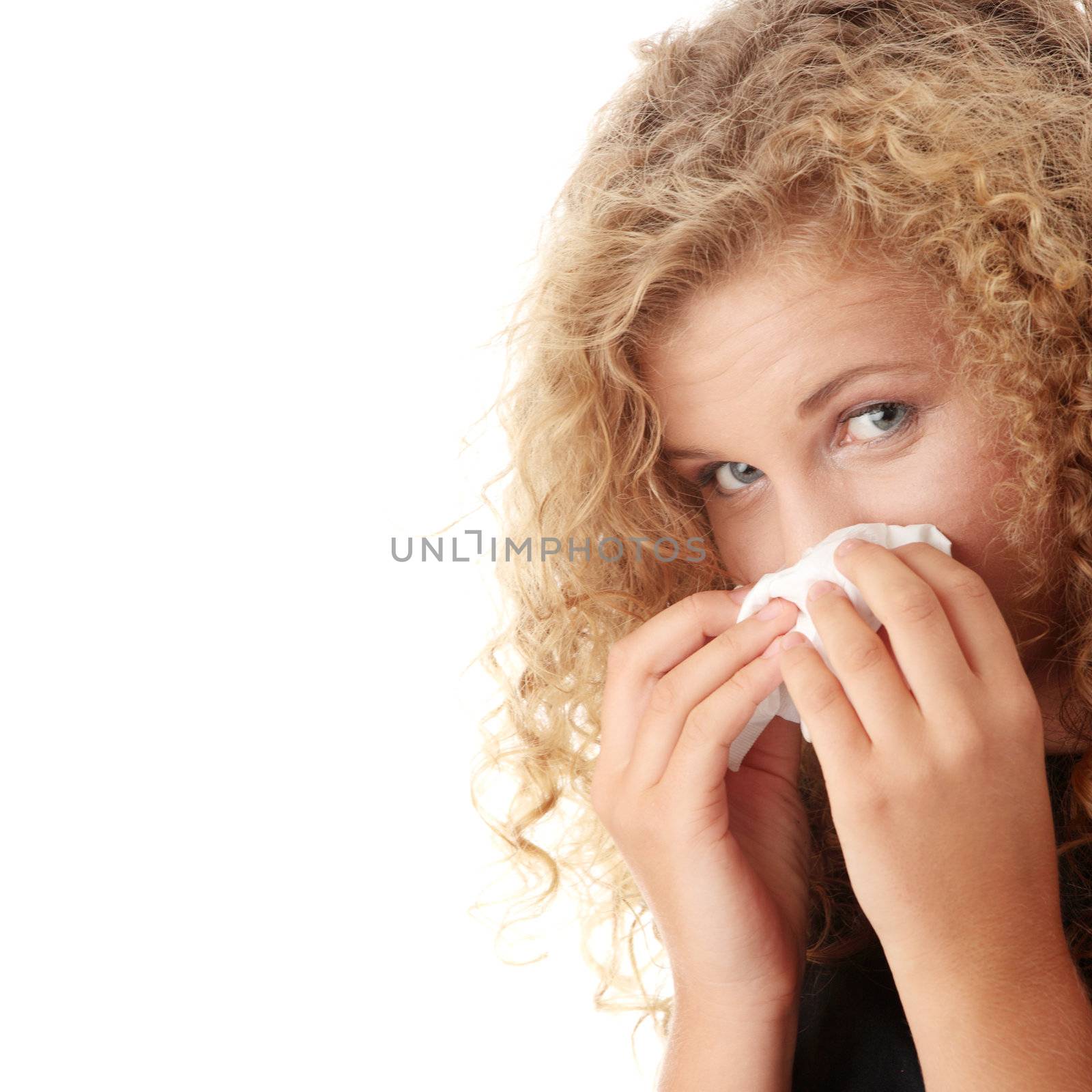 Young blonde woman having a cold close up isolated on white background