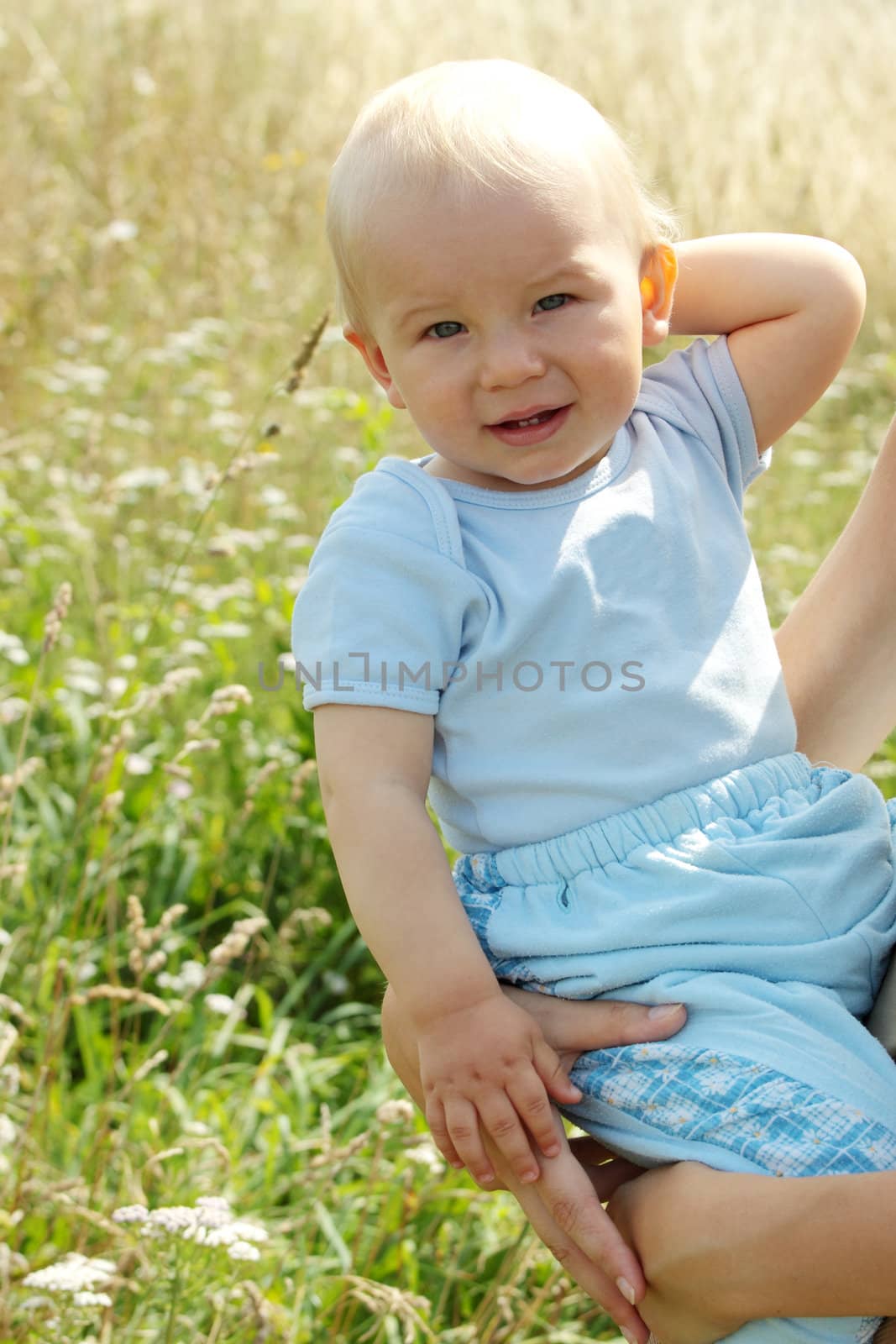 Adorable baby boy outdoors by BDS