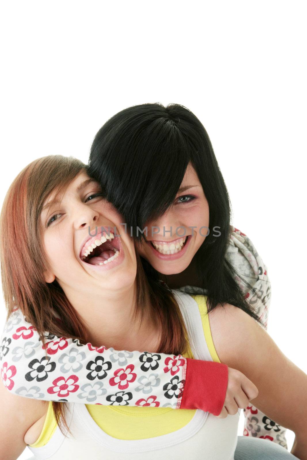 Two teen sisters isolated on white background