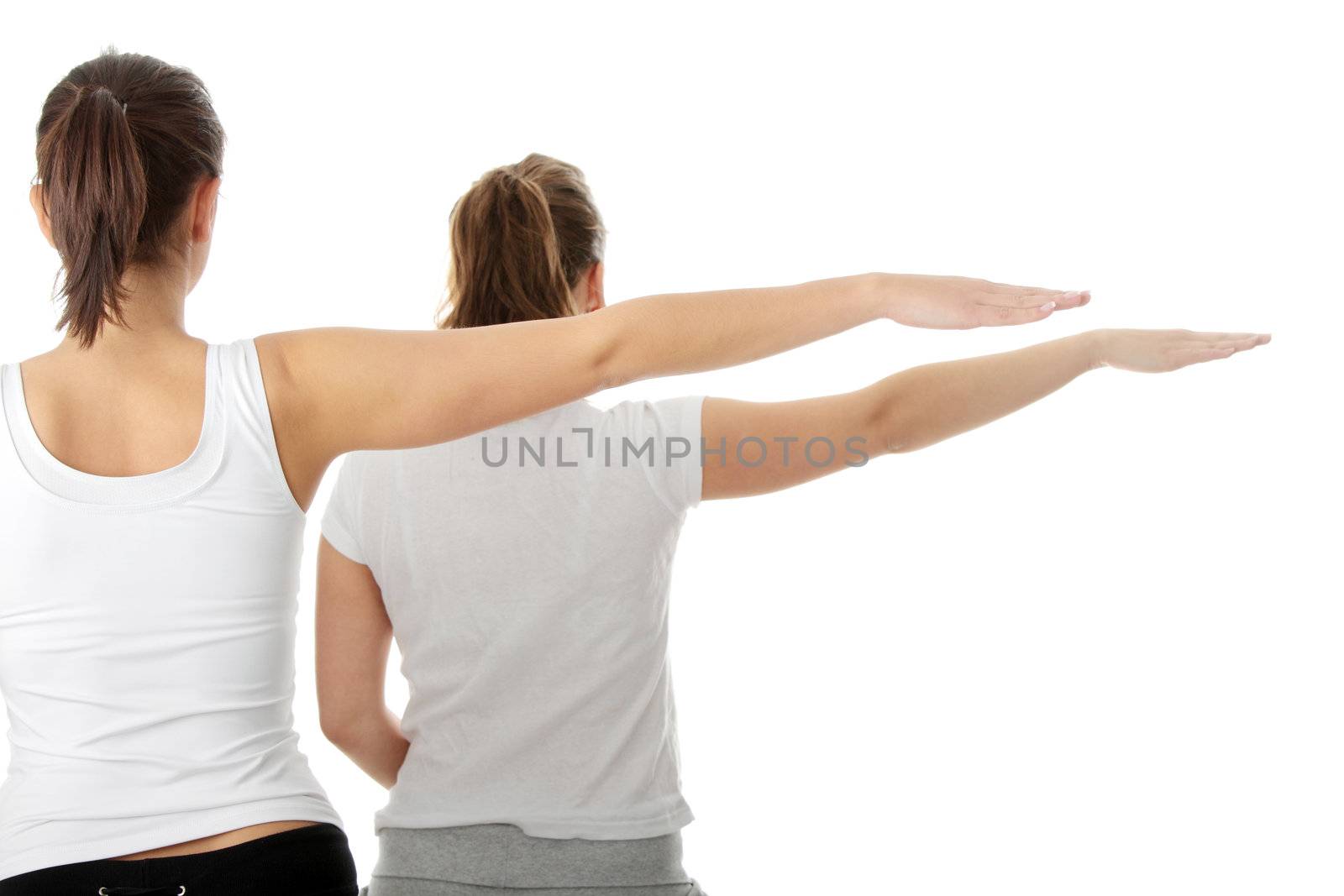 2 Beautiful young womans doing yoga exercise , isolated