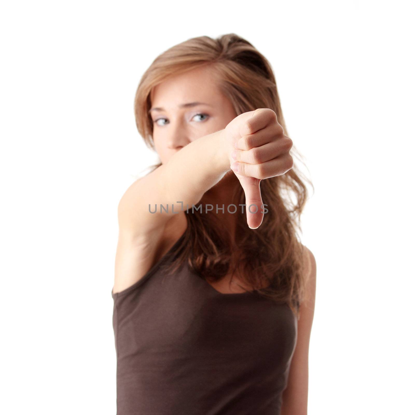 Young woman showing thumbs down isolated