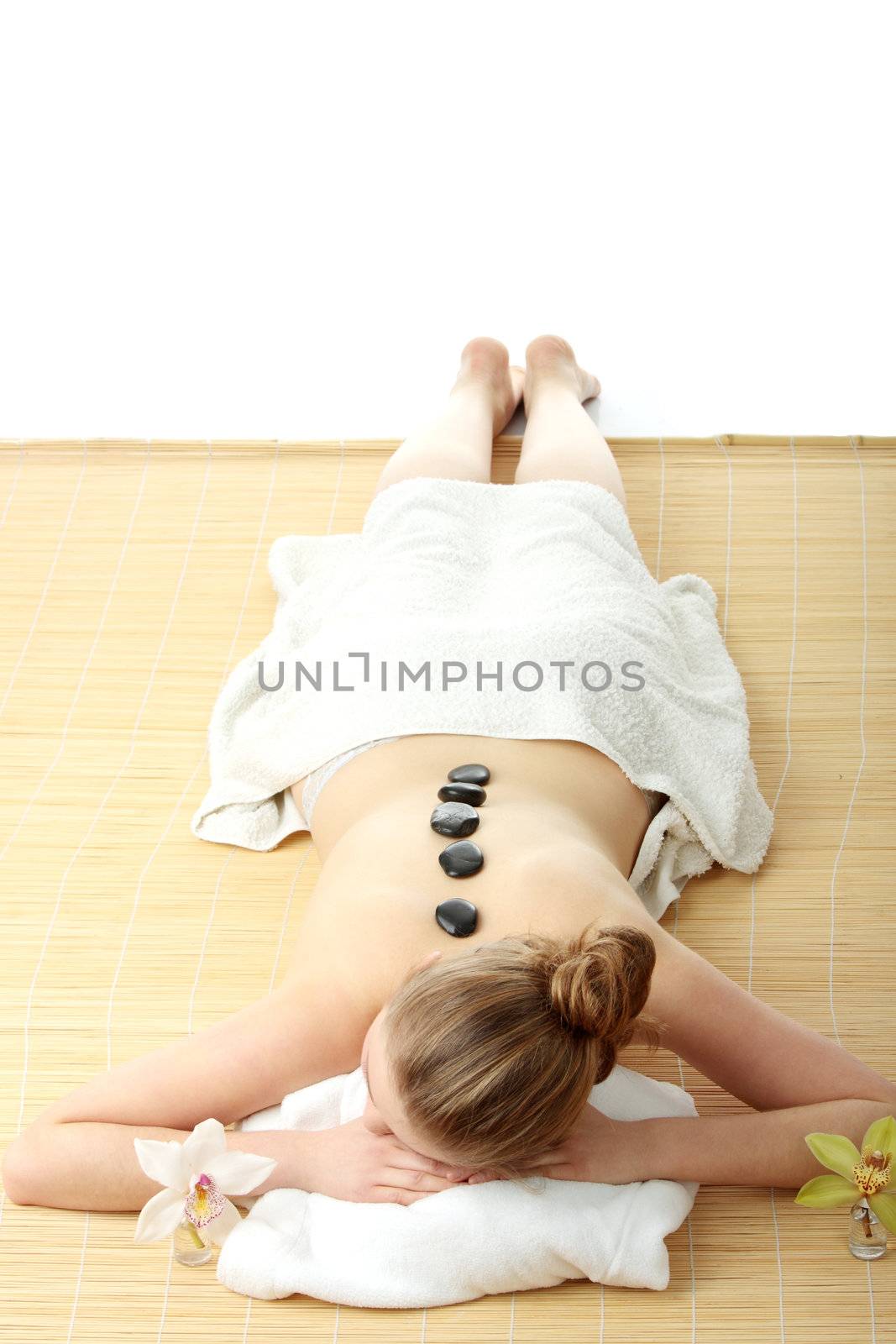 Attractive woman getting spa treatment isolated on white