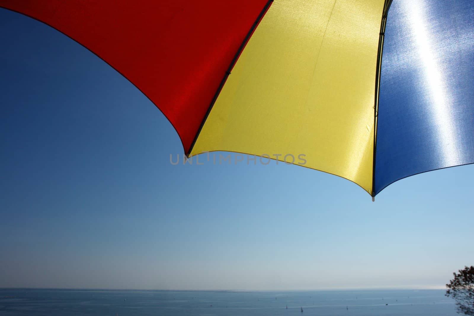 colorful parasol at the ocean on a sunny day