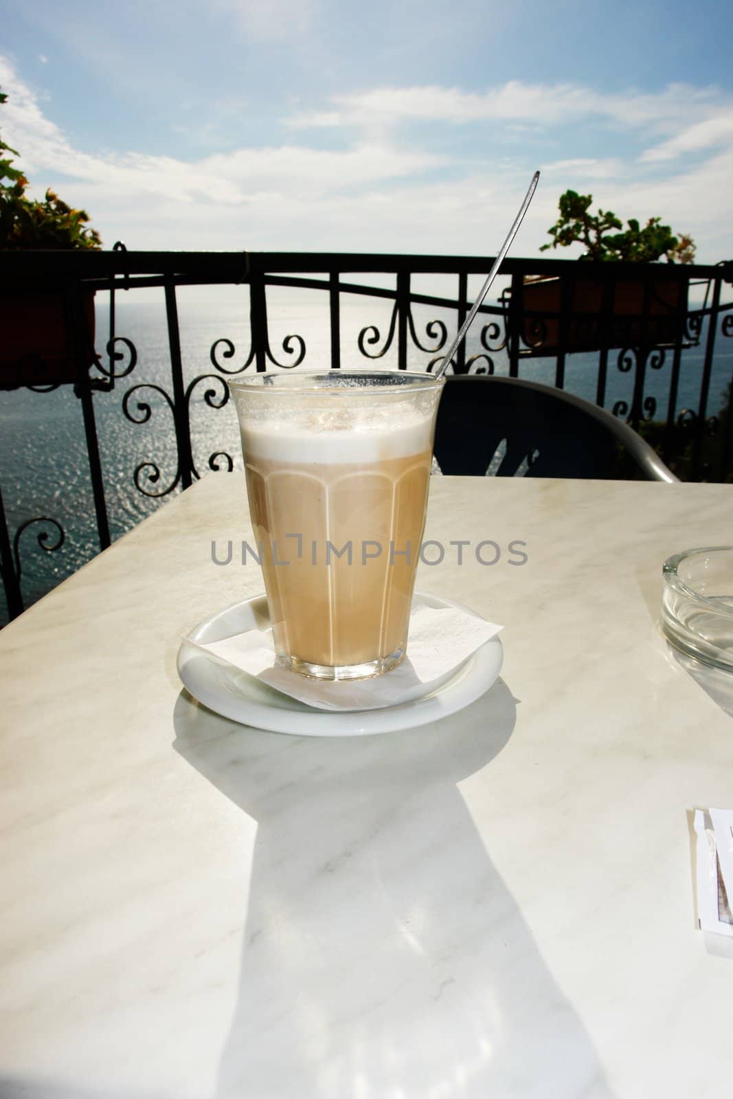 a cup of coffee over a wooden table