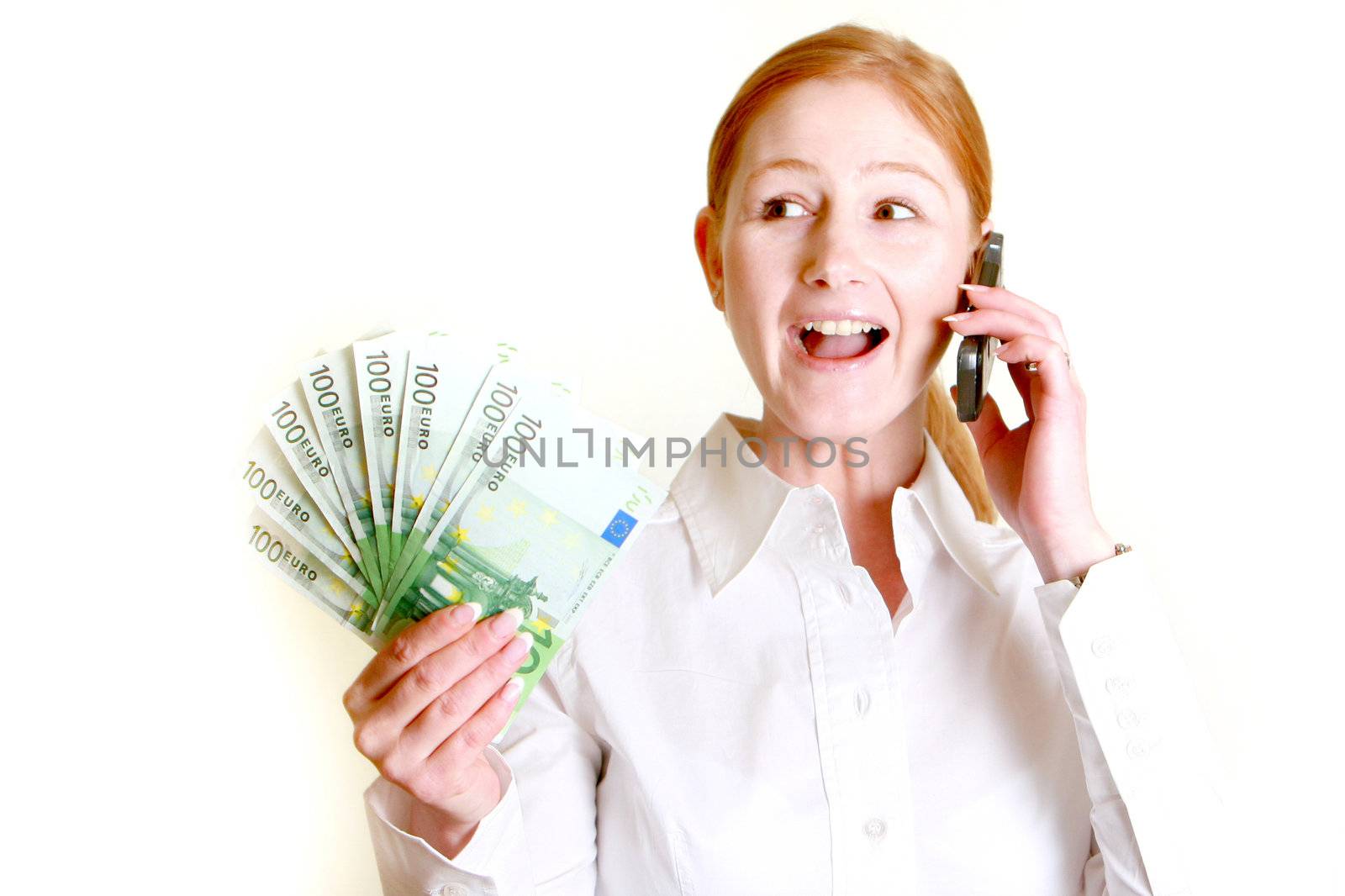 Happy woman holds many bills in his hand and calls
