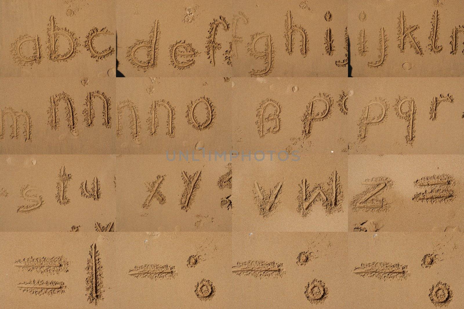 The Alphabet Written In Sand On A Beach. by yucas