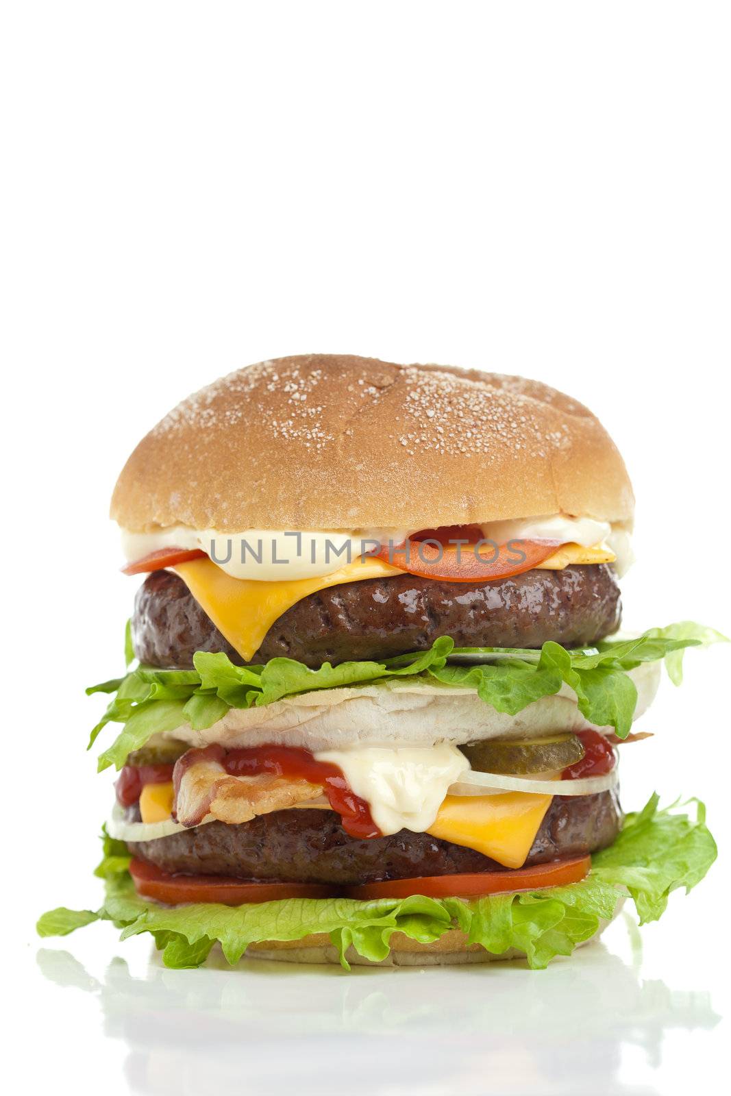 Big and good looking hamburger stacked high on white background