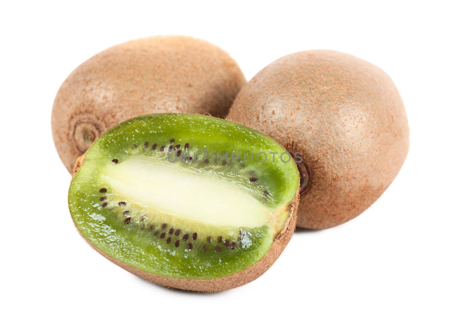 Macro view of three kiwi fruits.