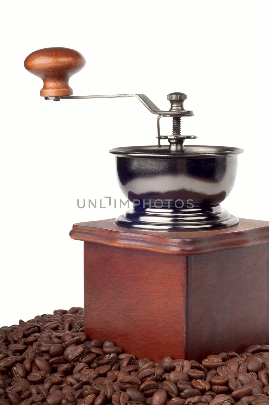 Coffee mill on the background of coffee beans