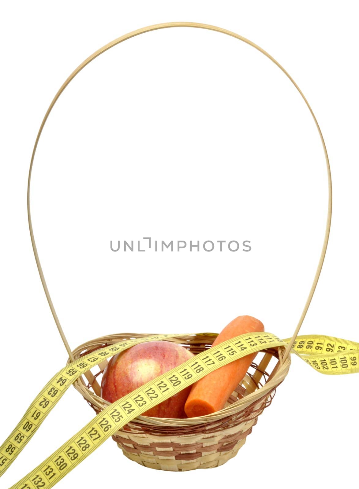 apples and carrots in a basket isolated on white