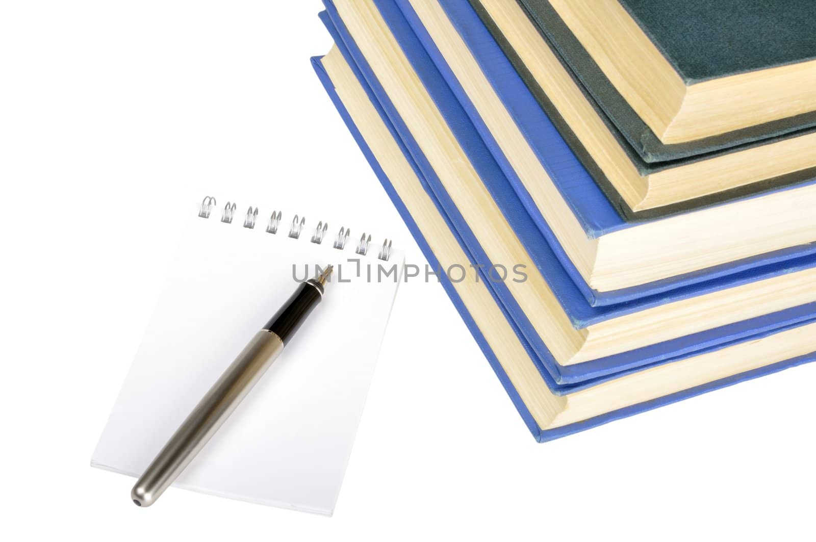 old books, notebook and pen