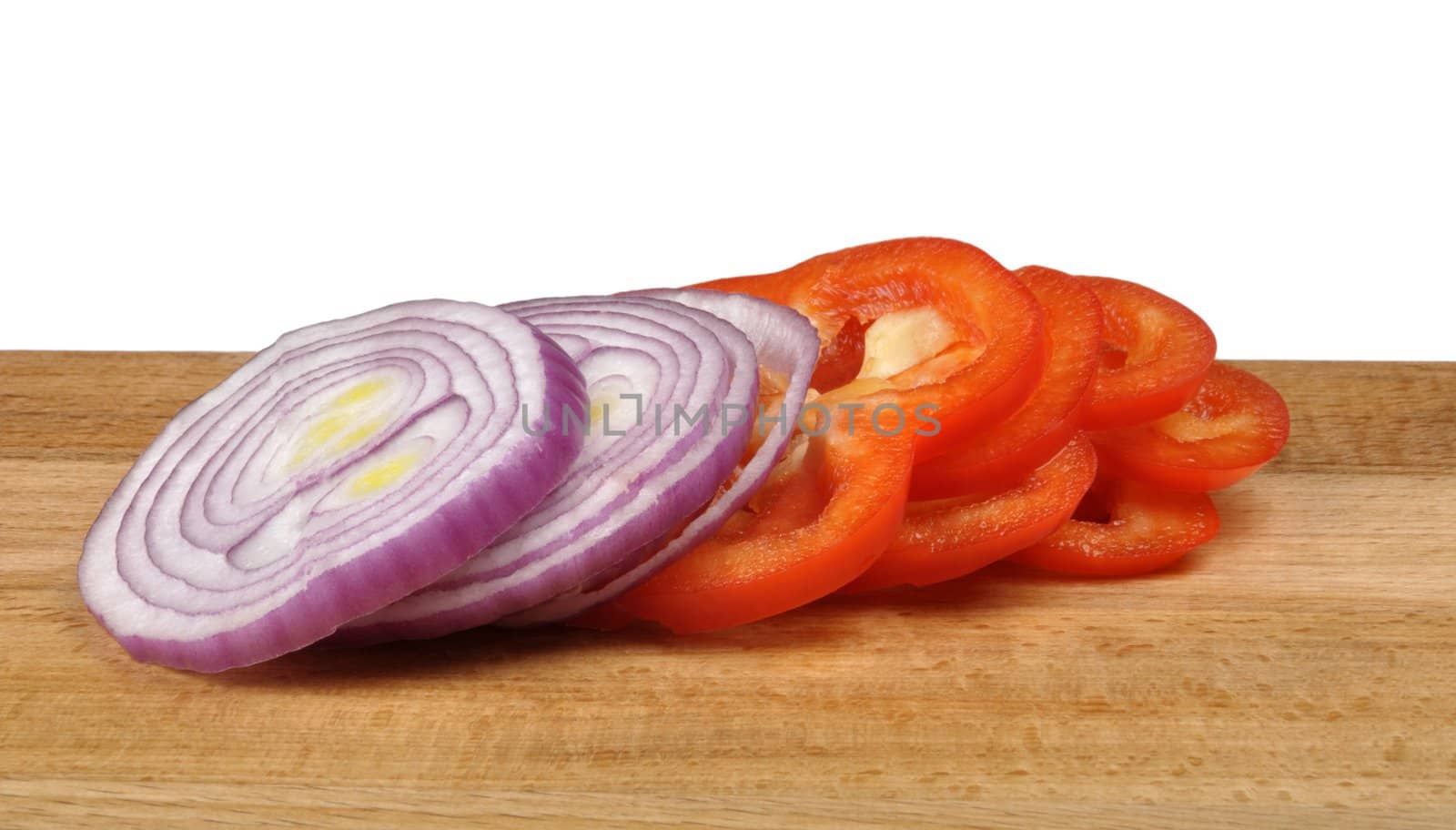 sliced onion and pepper on a wooden board