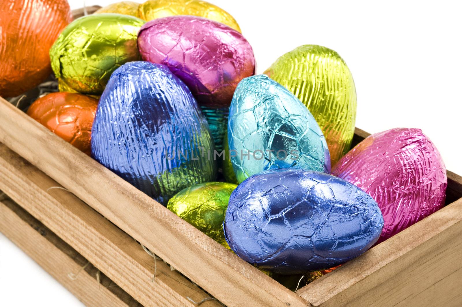 Colorful easter eggs in a box on a white background